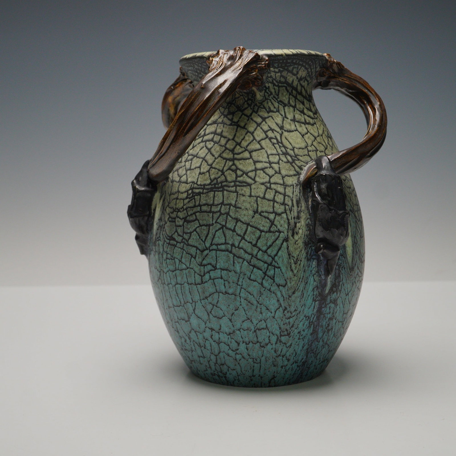 Ephraim Faience Pottery 25th Anniversary Three-Handled Vase: A striking studio pottery vase by Ephraim Faience, crafted in celebration of the 25th anniversary of the workshop in 2021. The vessel displays a richly textured and deeply crackled glaze that shifts f