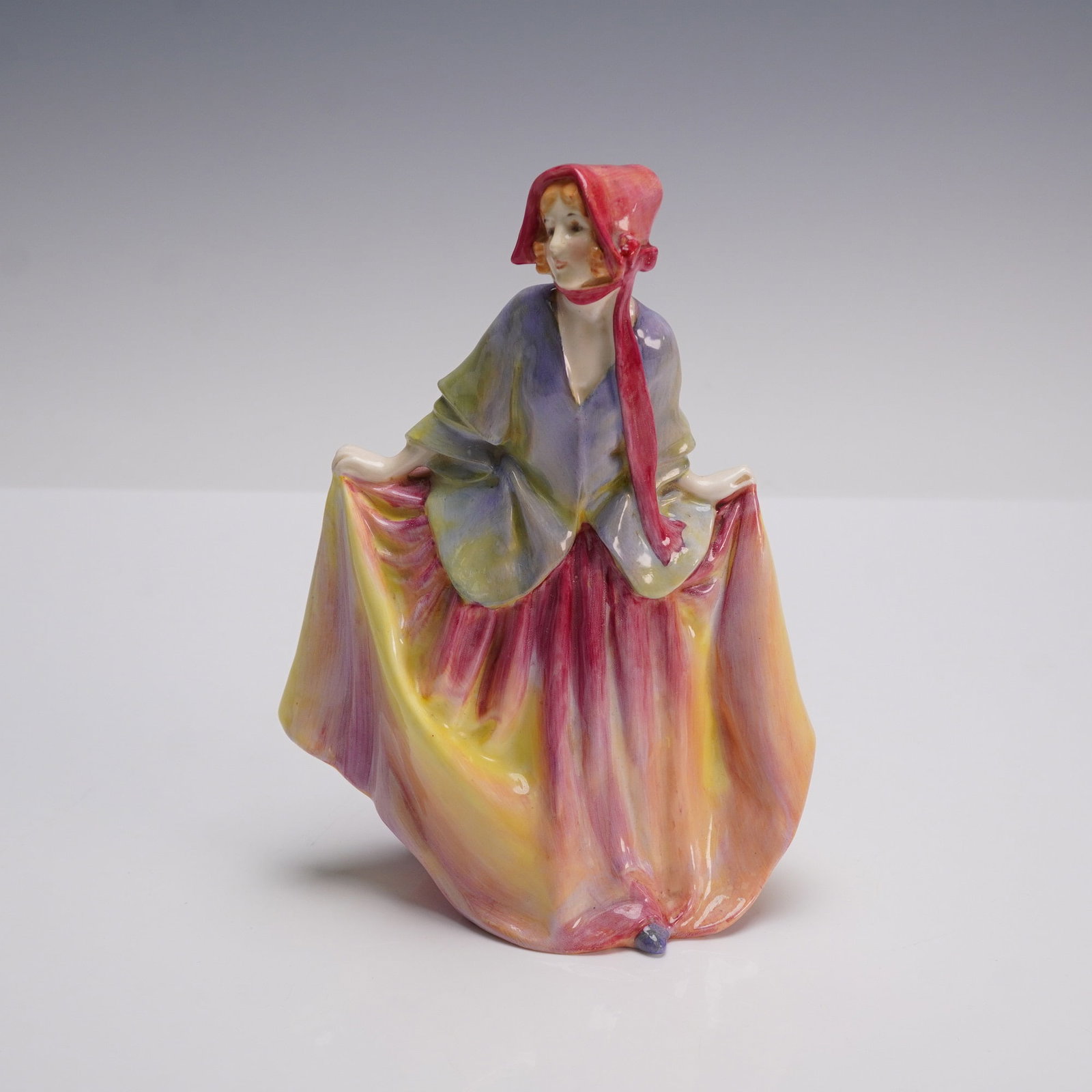 Royal Doulton Figurine, Sweet Anne HN1330: Presented is the Royal Doulton figurine Sweet Anne, HN1130. Modeled as a young woman in a flowing multicolored gown with a red bonnet, this early hand painted piece reflects the fine craftsmanship of 