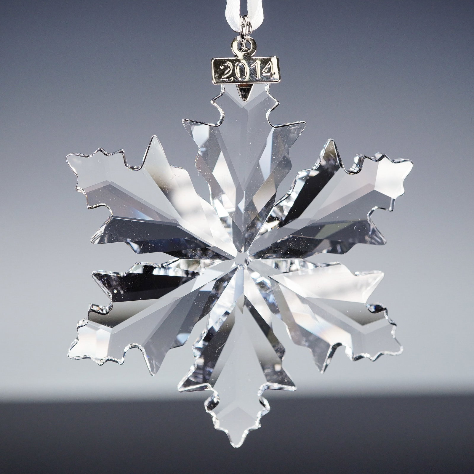 Swarovski Crystal Ornament, Christmas Snowflake 2014: A dazzling holiday collectible, this Swarovski crystal snowflake ornament was released exclusively in 2014. Expertly crafted in clear faceted crystal, it sparkles beautifully from every angle and is s