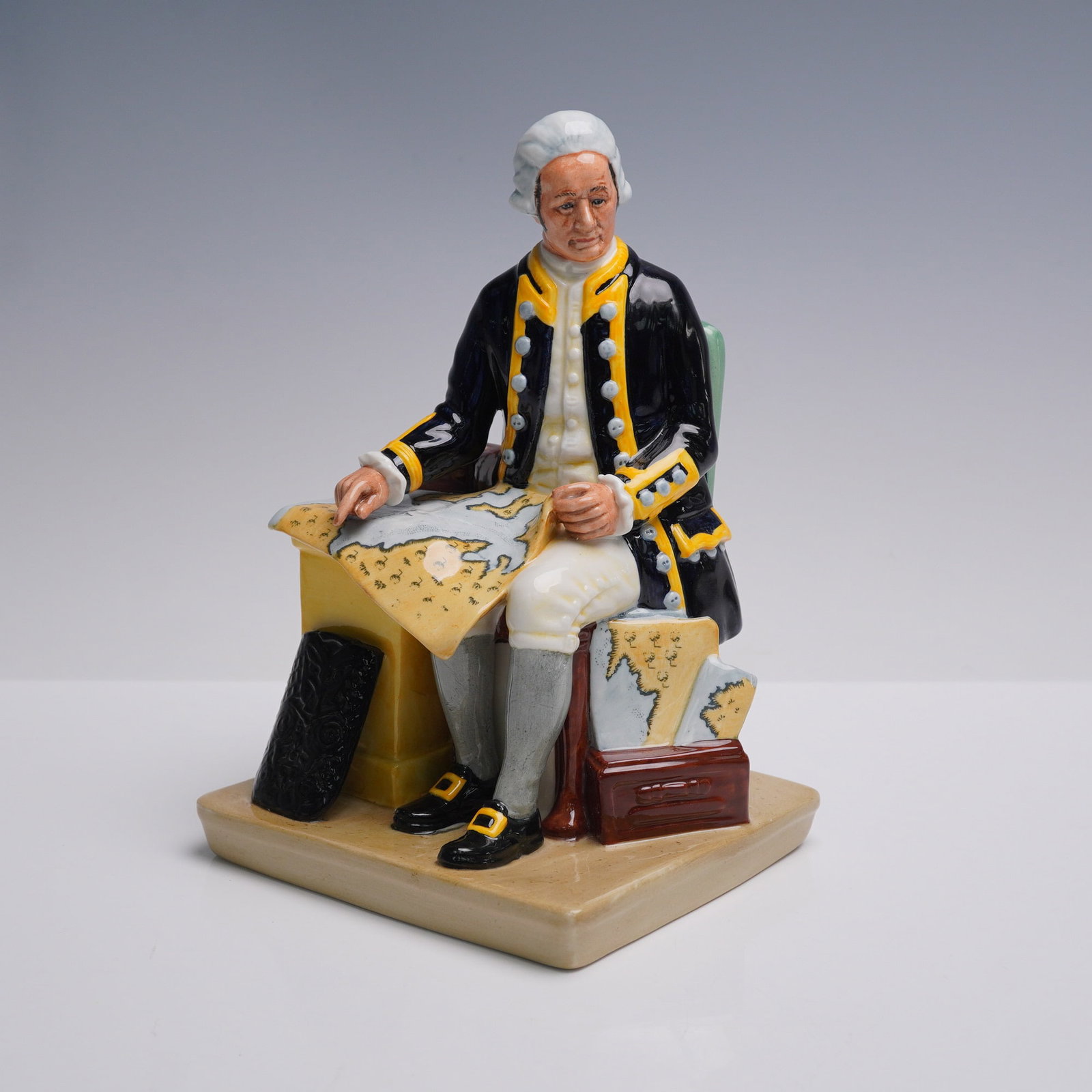 Royal Doulton Figurine, Captain Cook HN2889: Glossy porcelain; modelled after the famous British explorer and captain. From the Sea Characters series. Royal Doulton backstamp. Artist: William K. Harper Issued: 1980 - 1984 Dimensions: 4.5"L x 5.5