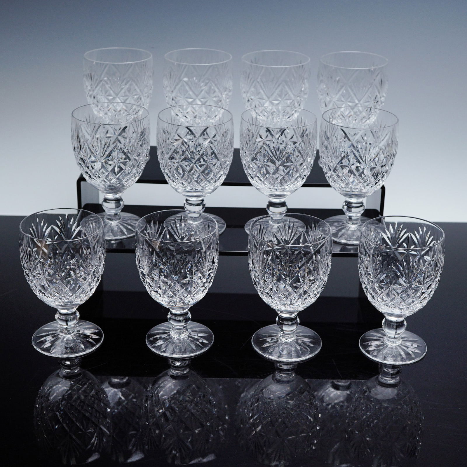 12pc Stuart Crystal Dessert Wine Glasses, Westbury Cut: Set of 12 cut crystal dessert wine glasses featuring a classic Westbury fan and diamond motif with faceted stems and rounded bowls. Ideal for serving port, sherry, or other sweet wines, these elegant
