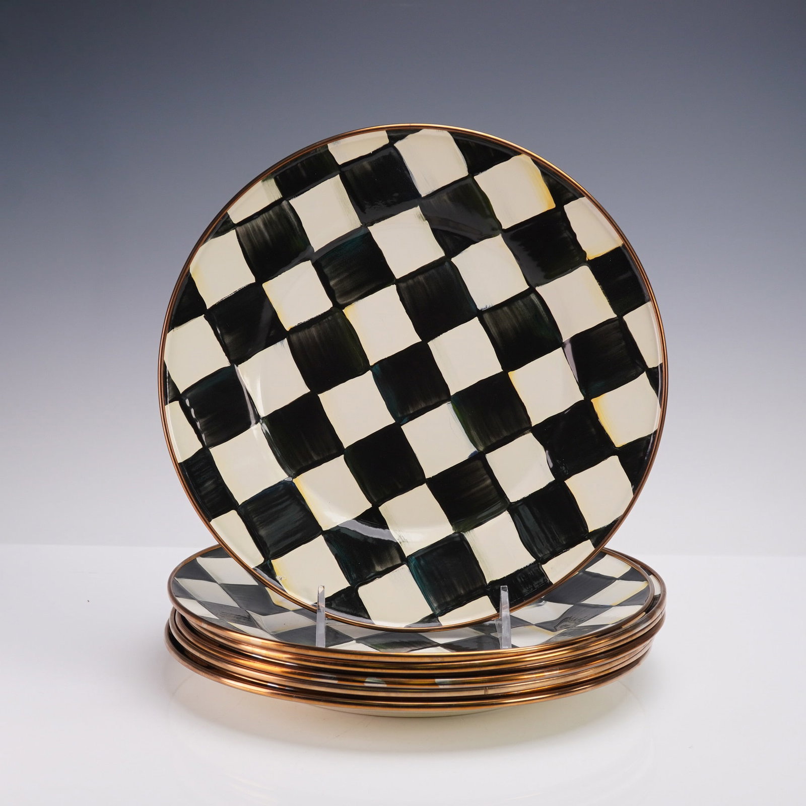8pc Mackenzie Childs Courtly Check, Dinner Plates: Set of eight enamelware dinner plates by Mackenzie Childs in the Courtly Check pattern. Each plate features a hand-painted black and white checkered design with variations in brushwork and color shadi