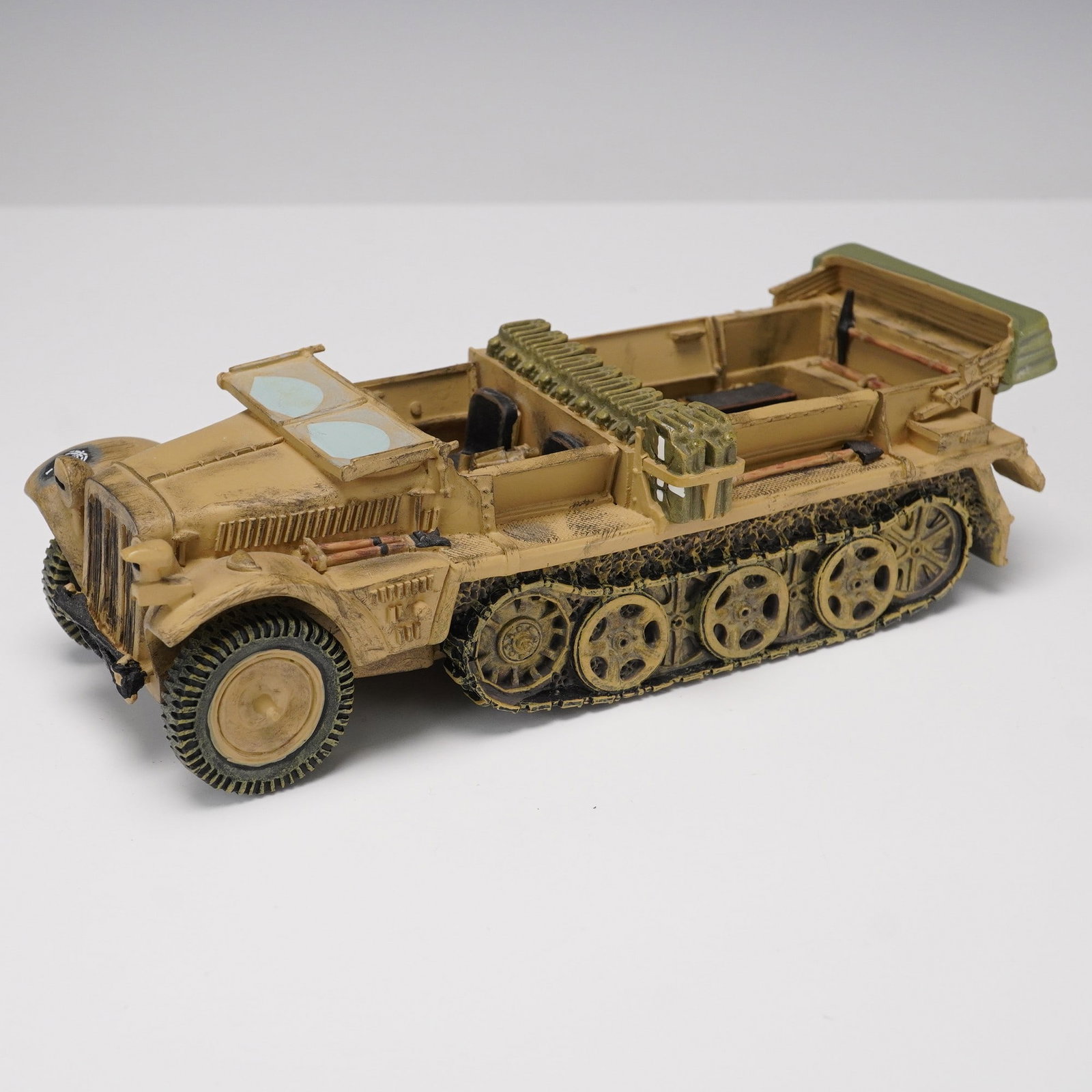 King & Country Demag Model Half-Track Vehicle: Detailed and weathered model of a World War II-era German Sd.Kfz. 10 Demag half-track vehicle by King & Country. This highly collectible piece features open seating, molded ammunition storage, and per