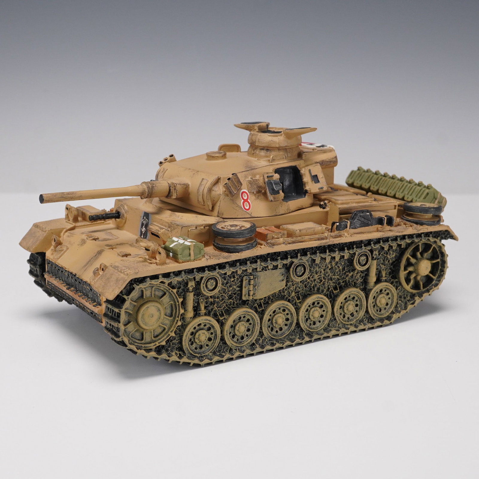 King & Country Panzer III, Desert Camo Tank Model: King & Country 1:30 scale Panzer III tank model, painted in North African desert camouflage with weathered detailing and accessories including spare wheels, jerry cans, and stowage. Features molded tr