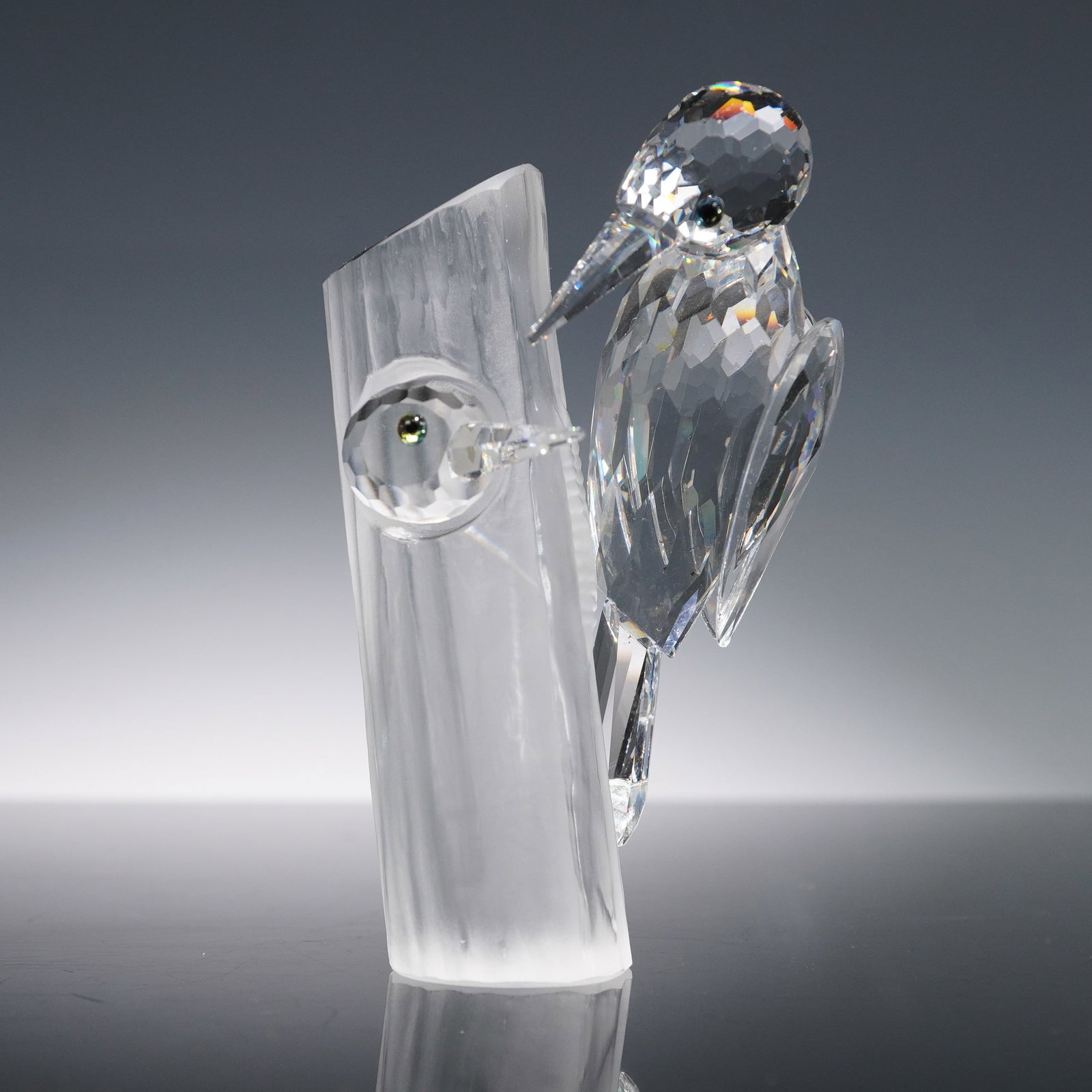 Swarovski Crystal Figurine, Woodpeckers Sharing 14745: Swarovski crystal figurine Woodpeckers Sharing 14745, issued in 1988 as the second Swarovski Crystal Society Annual Edition and part of the Caring and Sharing trilogy. Designed by Adi Stocker, the pie