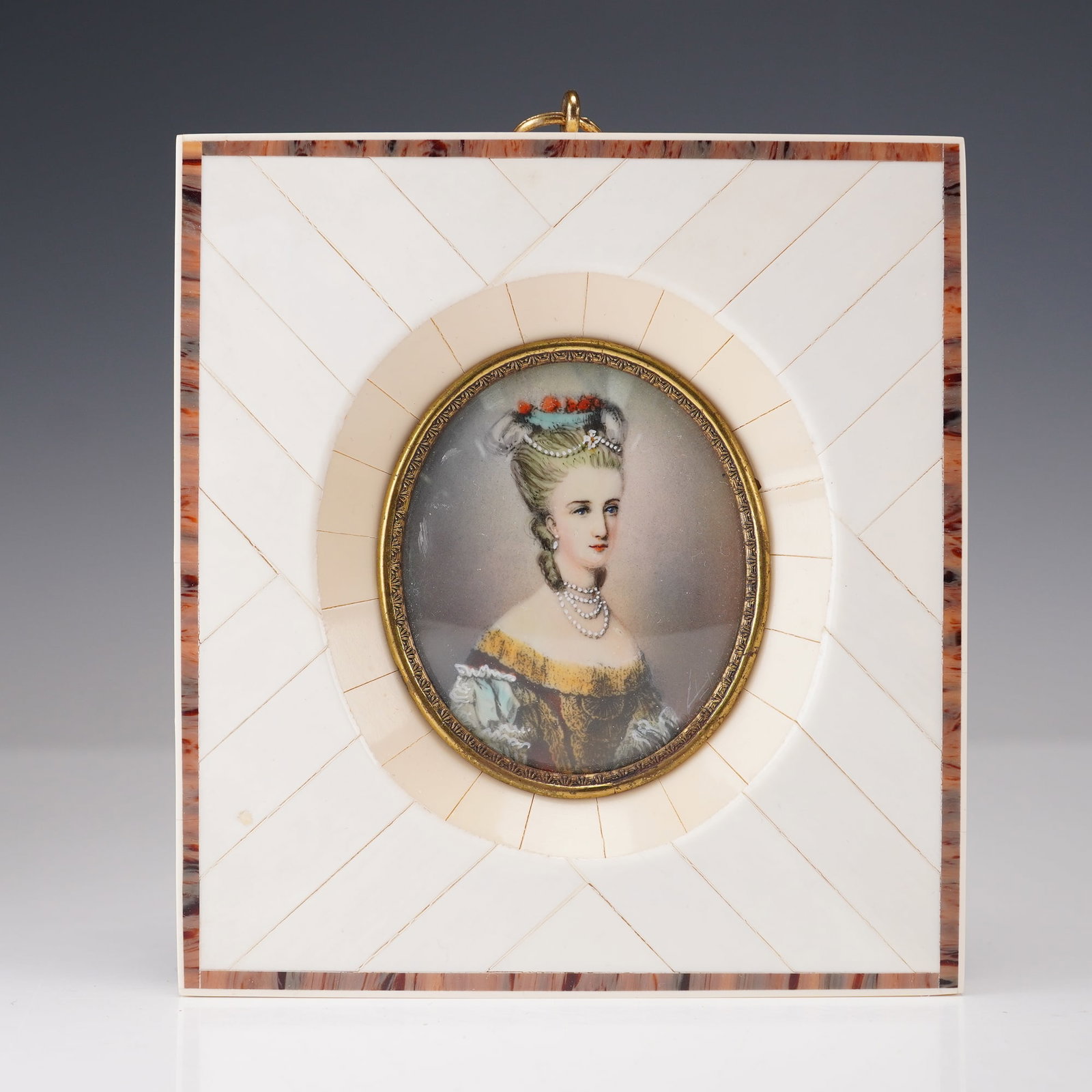 Antique Miniature Portrait of Countess D' Artois, Bone Frame: A hand-painted miniature portrait of the Countess D Artois, displayed in an oval gilded frame. The portrait depicts the Countess wearing a yellow off-the-shoulder gown with lace detailing, pearl jewel