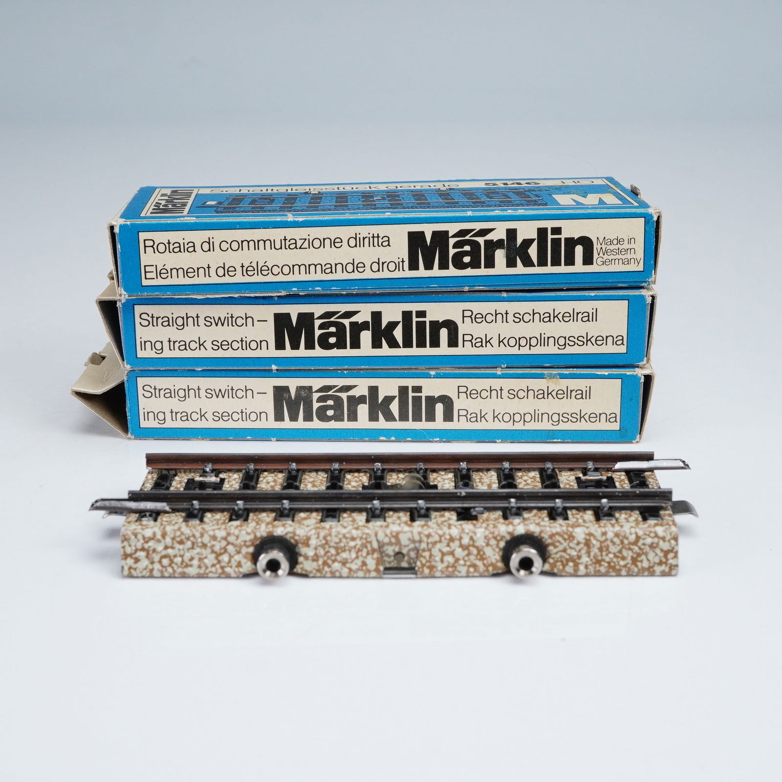 3pc Marklin Model Railroad Track Set, Straight Switching Track Section: Set of three Marklin straight switching track sections, model number 5146, in HO scale. Each section is designed for use with Marklin model railroad systems and features a built-in electrical switch m