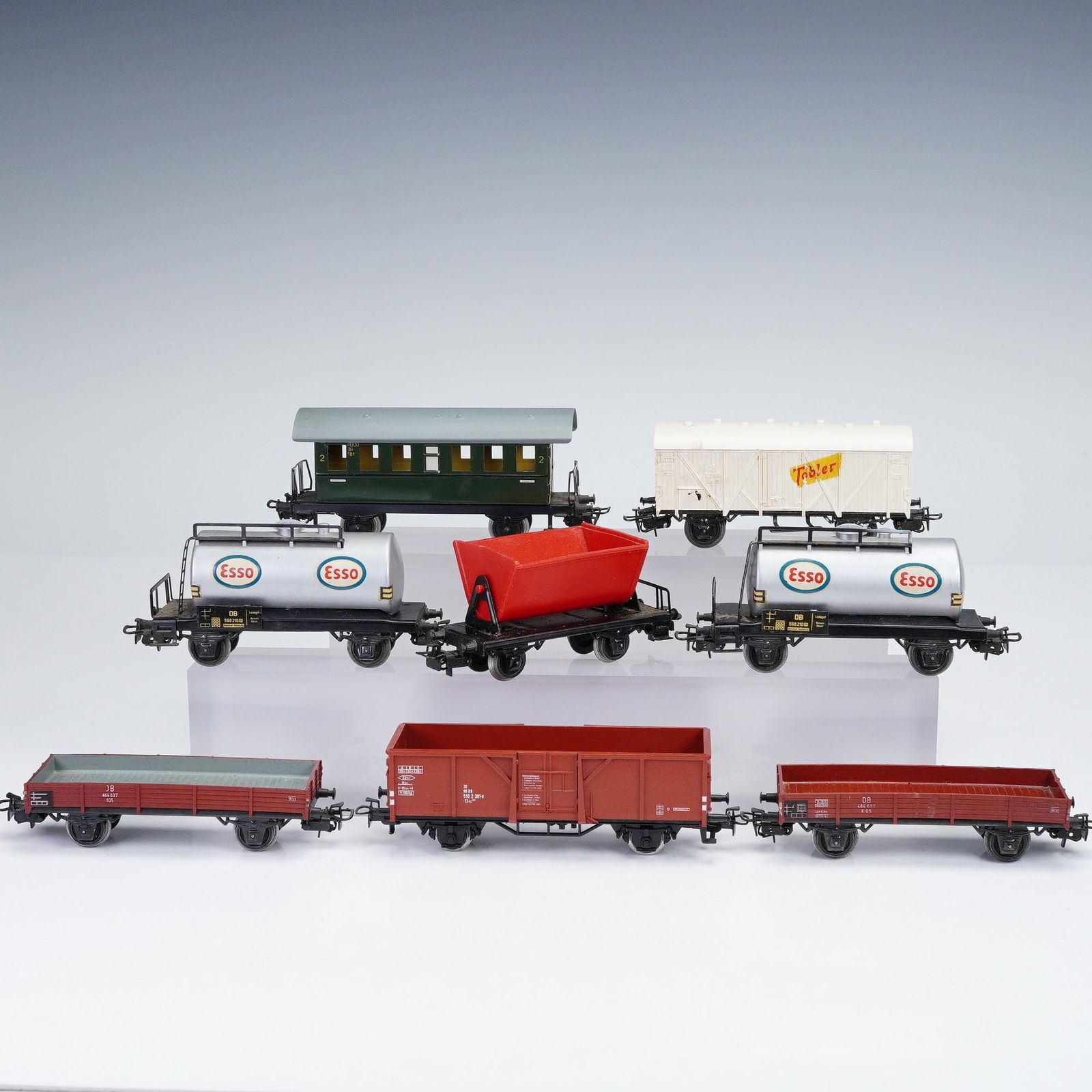 8pc Vintage Marklin HO Scale Model Trains, Freight and Passenger Cars: This lot includes eight Marklin HO scale model trains, each marked "Marklin" and "Germany" on the underside. The set features a nice mix of freight and passenger cars, showcasing classic German model