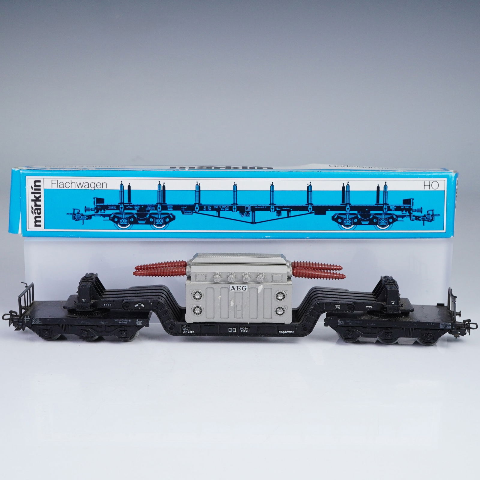 2pc Vintage Marklin HO Scale German Railway Freight Cars: This lot features two Marklin HO scale German railway freight cars, both made in Western Germany, showcasing the brand's renowned quality and attention to detail. The first piece is a Marklin heavy-du
