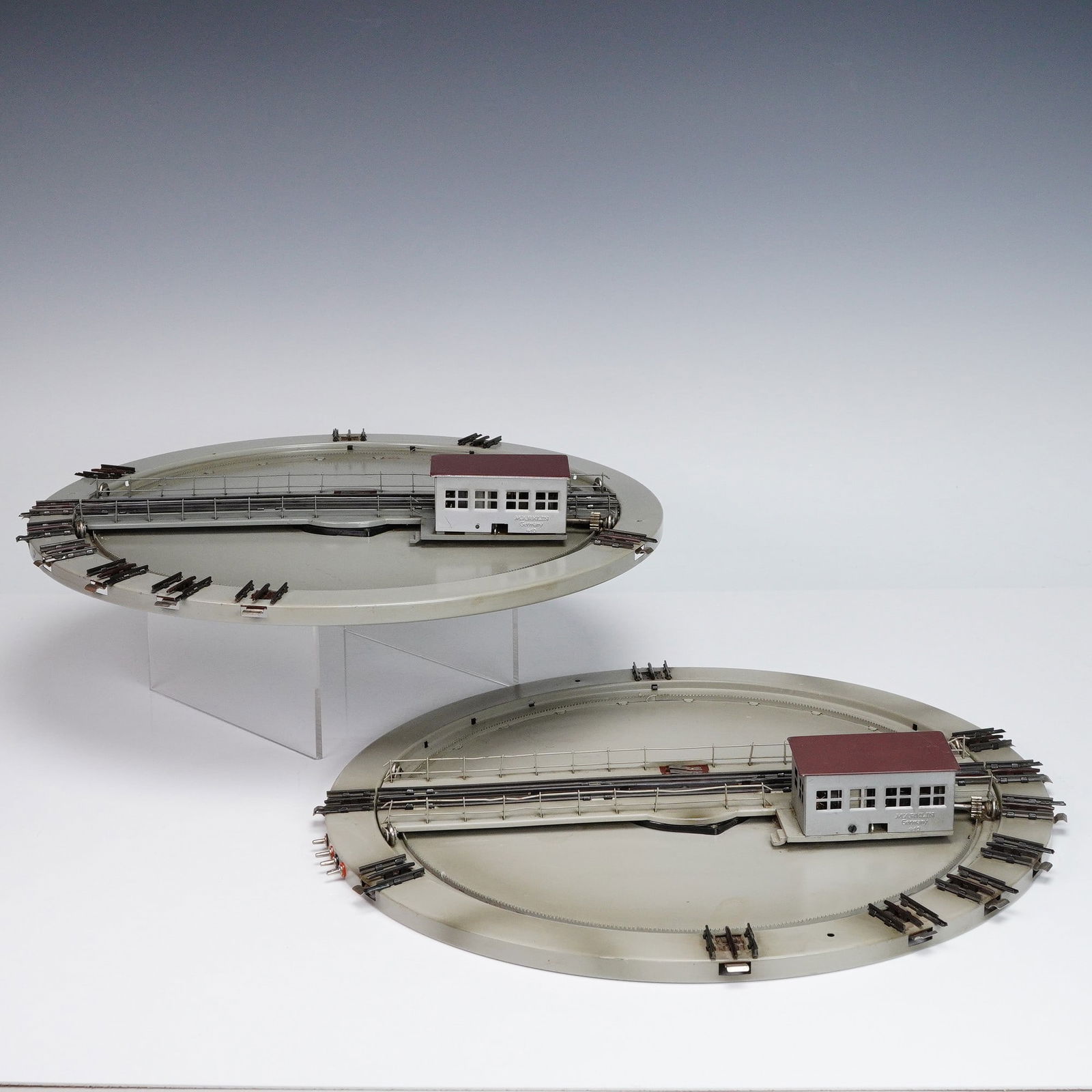 2pc Vintage Marklin Electric Train Turntables: This listing features a pair of vintage Marklin electric train turntables, model 410, made in Germany. These highly collectible pieces are crafted from sturdy metal and showcase Marklin's renowned eng