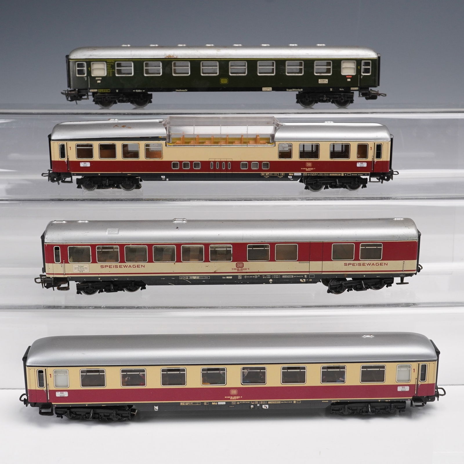 4pc Marklin HO Scale Passenger Coaches: Group of four Marklin HO scale German passenger coaches including one green Deutsche Bundesbahn coach and three cream and red livery Speisewagen dining and passenger cars, each marked Marklin Made in