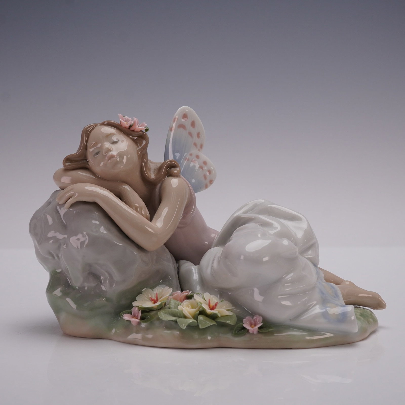 Lladro Porcelain Figurine, Princess of the Fairies 01007694: Lladro porcelain figurine 01007694, titled Princess of the Fairies, sculpted by Joan Coderch. Issued in 2002 and retired in 2003, this glazed figurine was the second Annual Edition in the Lladro Privi