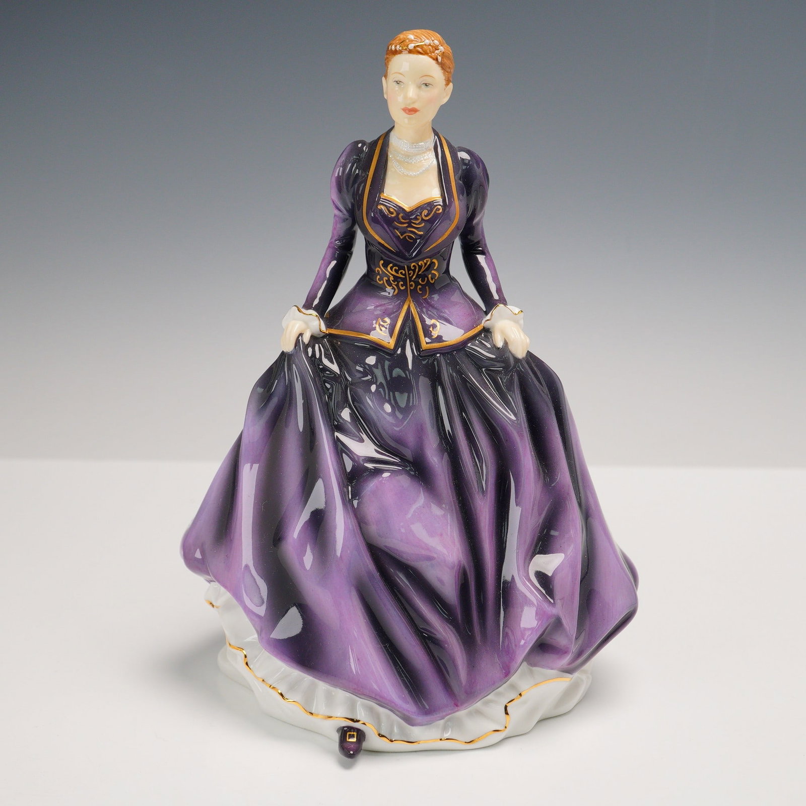 Royal Doulton Figurine, Pretty Ladies, Victoria, HN5543: This exquisite Royal Doulton "Pretty Ladies" figurine, titled Victoria (HN 5543), is a Michael Doulton Exclusive from 2012. Beautifully hand-made and hand-decorated in fine bone china, this elegant pi