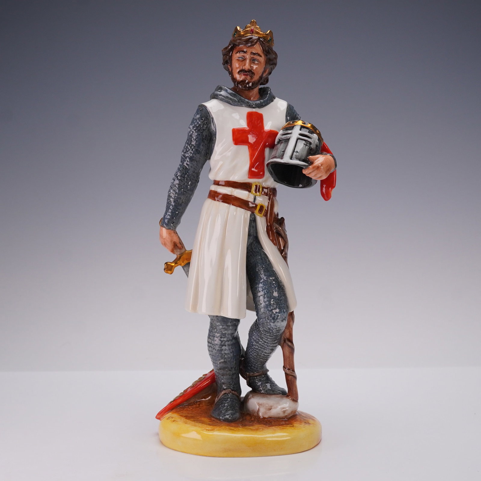 Royal Doulton Porcelain Figurine, Richard the Lionheart HN3675: Royal Doulton porcelain figurine HN3675, titled Richard the Lionheart. This striking hand painted figure depicts King Richard I of England dressed in a white tunic with a bold red cross over chainmail