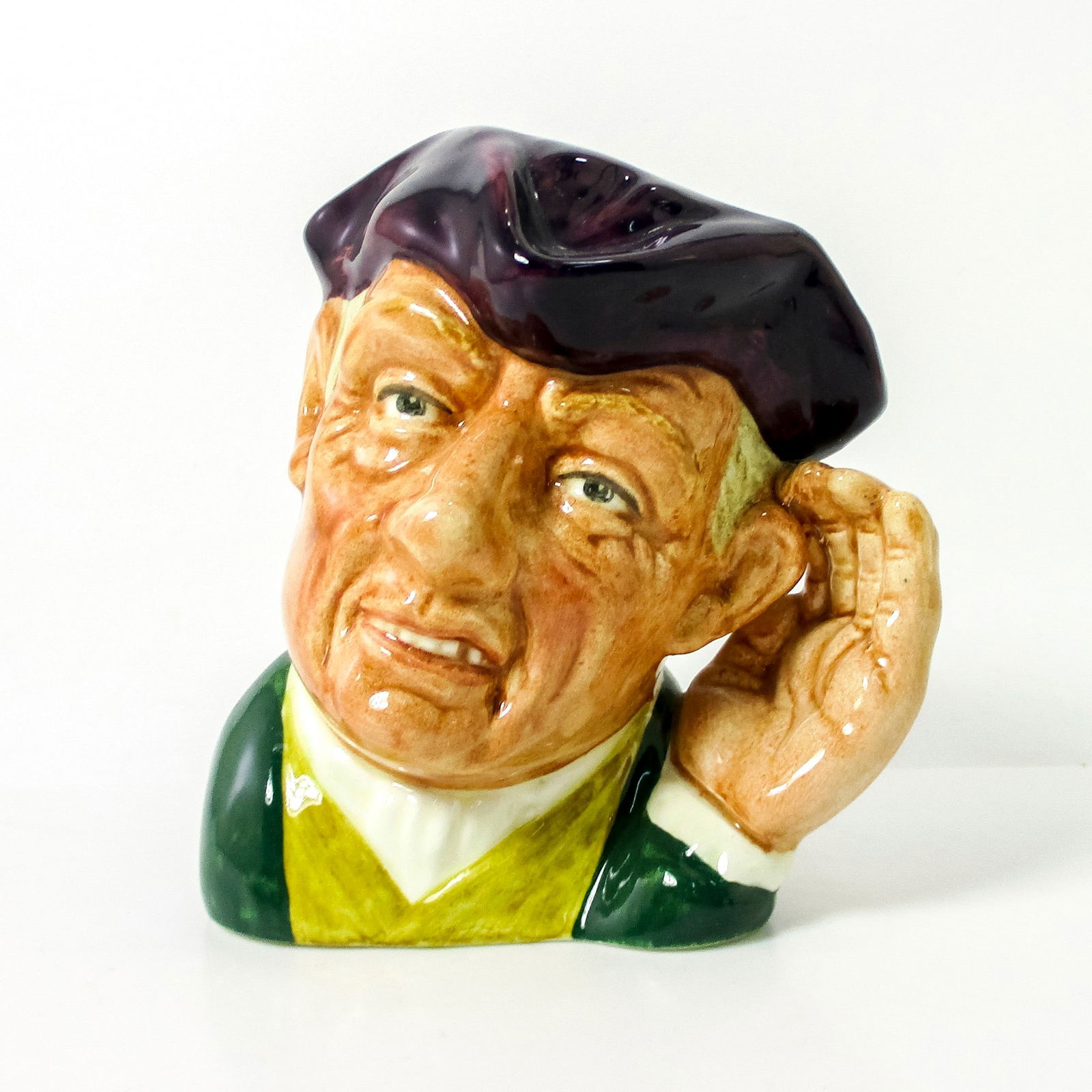 Ard of Earing D6591 - Small - Royal Doulton Character Jug: Dark purple tricorn; green, white, and yellow clothing. Royal Doulton backstamp. Artist: David B. Biggs Issued: 1964 - 1967 Dimensions: 3.5"H Country of Origin: England