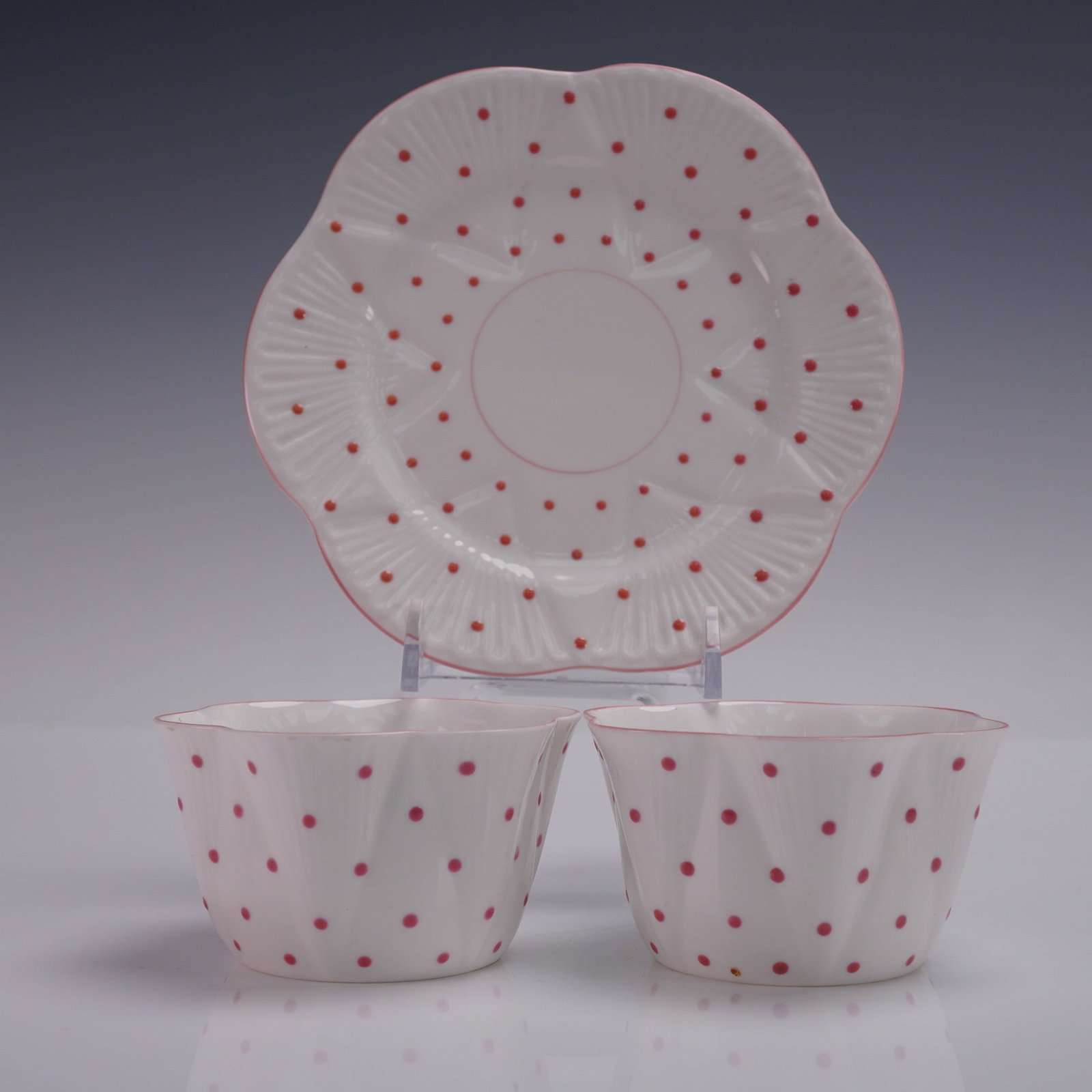 3pc Shelley Fine Bone China Teacup Set Pink Polka Dot 13748: Shelley England fine bone china 3-piece teacup set in pattern number 13748, featuring a fluted design with vivid pink polka dots and delicate pink edging on white ground. The set includes two teacups 