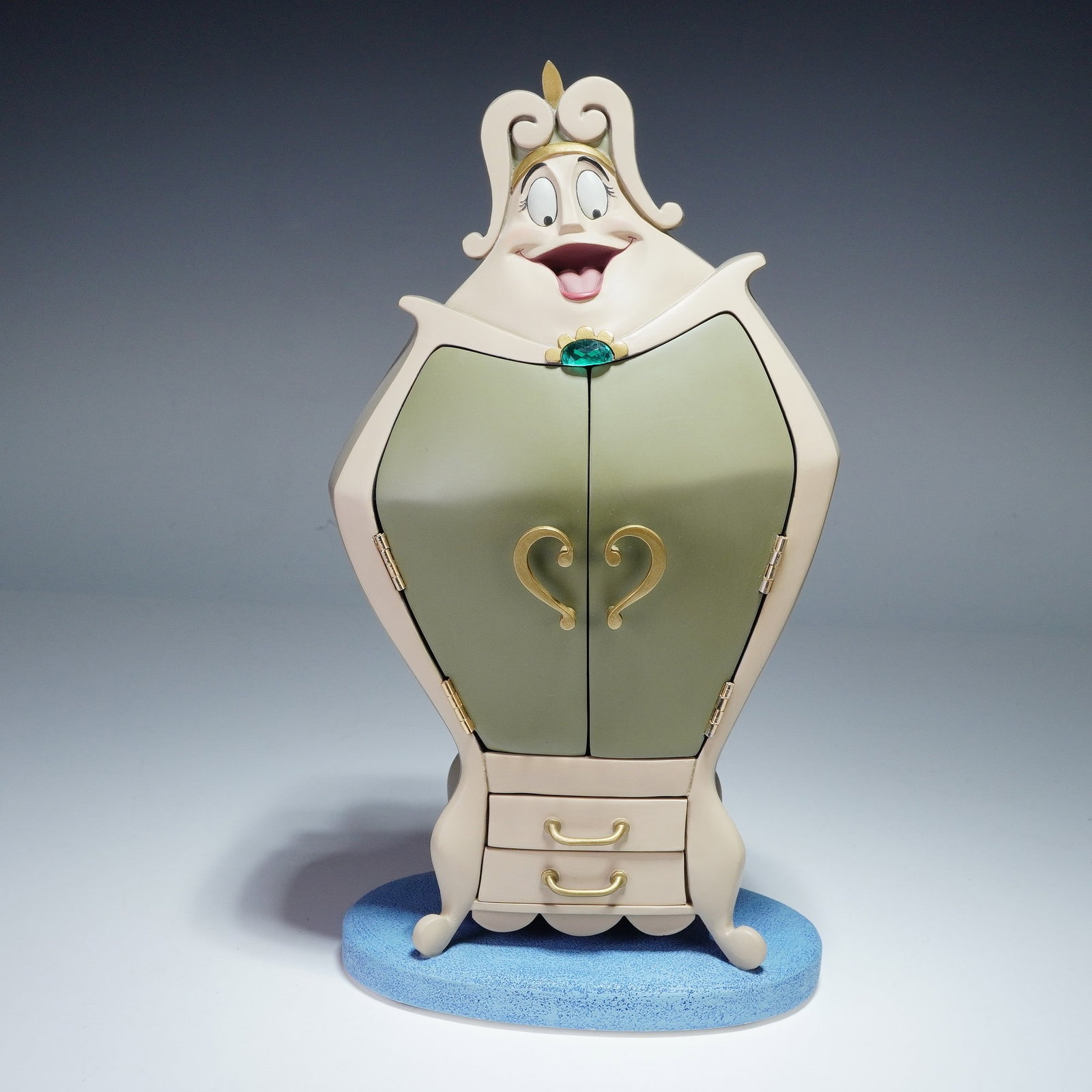 Walt Disney Classics Figurine, Wardrobe, Beauty and The Beast: This charming Disney Classics Collection figurine, titled "You'll Look Ravishing in This One," captures the beloved Wardrobe character from Disney's Beauty and the Beast. Expertly crafted in fine porc