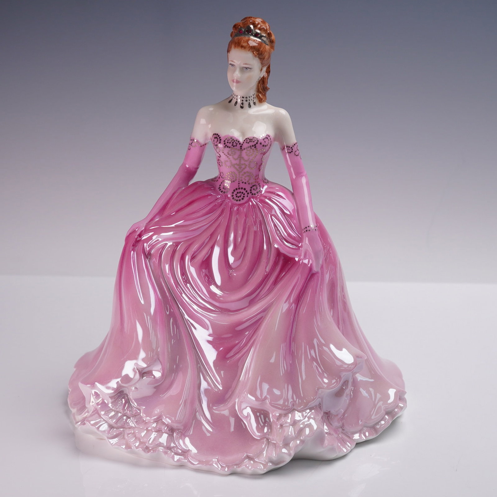 Coalport Figurine Lady Sophia at the Ball Society Ladies 2006: Coalport bone china figurine titled Lady Sophia at the Ball from the Society Ladies series. Modeled by Jack Glynn and issued in 2006, this hand-decorated figure features a red-haired lady dressed in a
