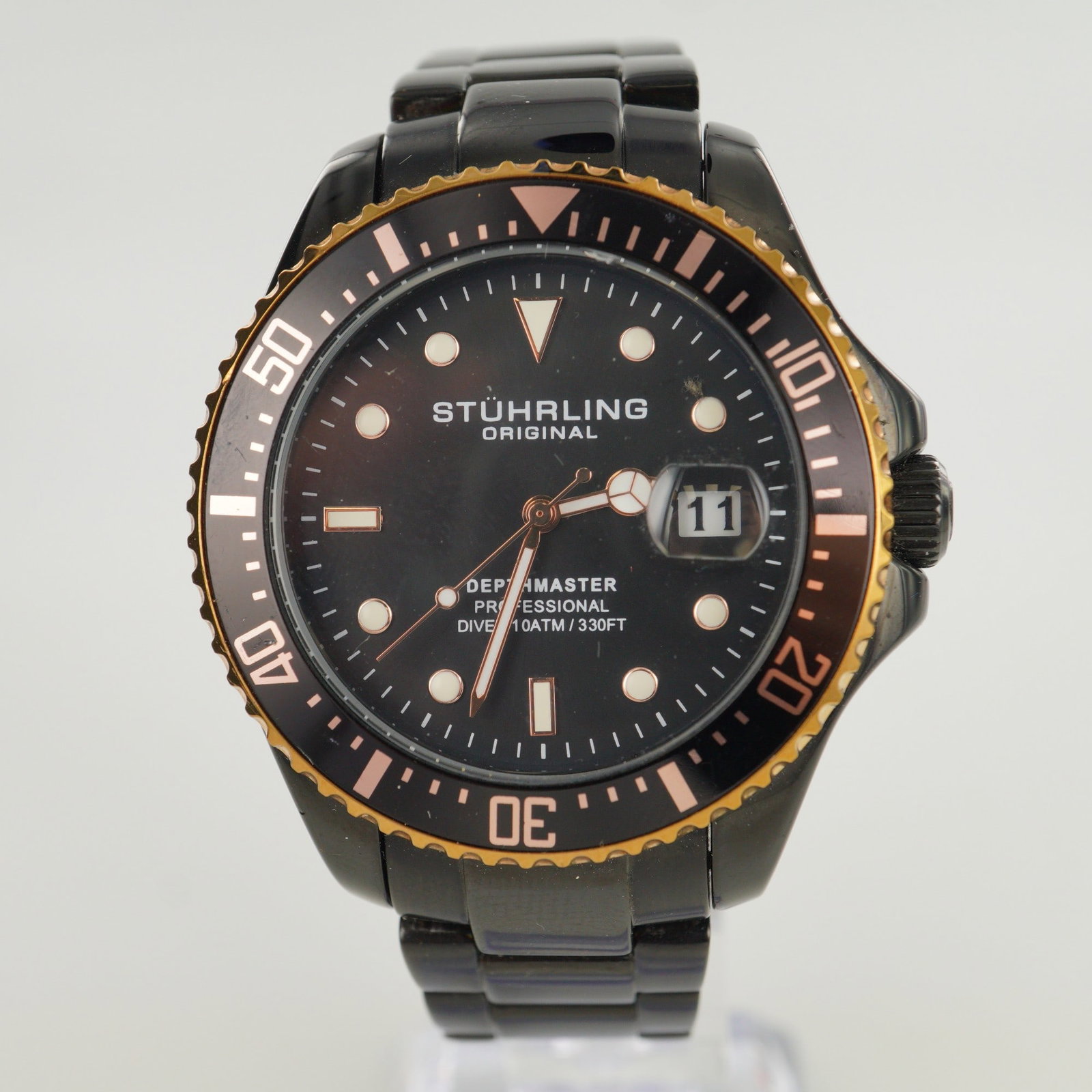 Stuhrling Original Depthmaster Professional Diver Wrist Watch: The watch face is marked "Stuhrling Original Depthmaster Professional Diver 10ATM / 330FT." The case back is engraved with "Stuhrling Original, Stainless Steel, Krysterna Crystal, Miyota Movement 1URO