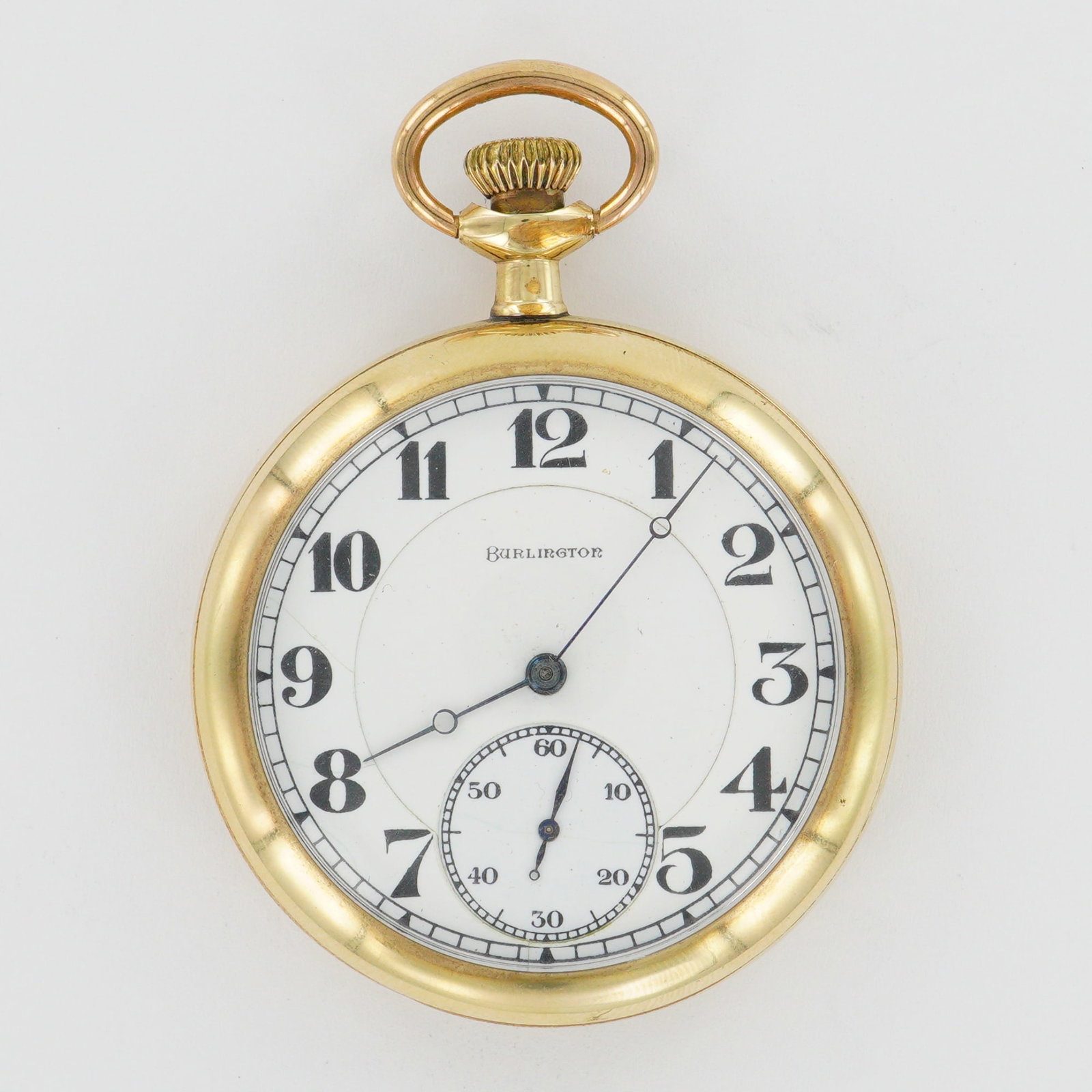 Burlington Watch Co. 16S Gold Filled LS Pocket Watch, 25 Year: A well-preserved Burlington Watch Co. 16 size pocket watch featuring a white dial with bold black Arabic numerals and a recessed seconds subdial. The case is marked by the Burlington Watch Co. and gua