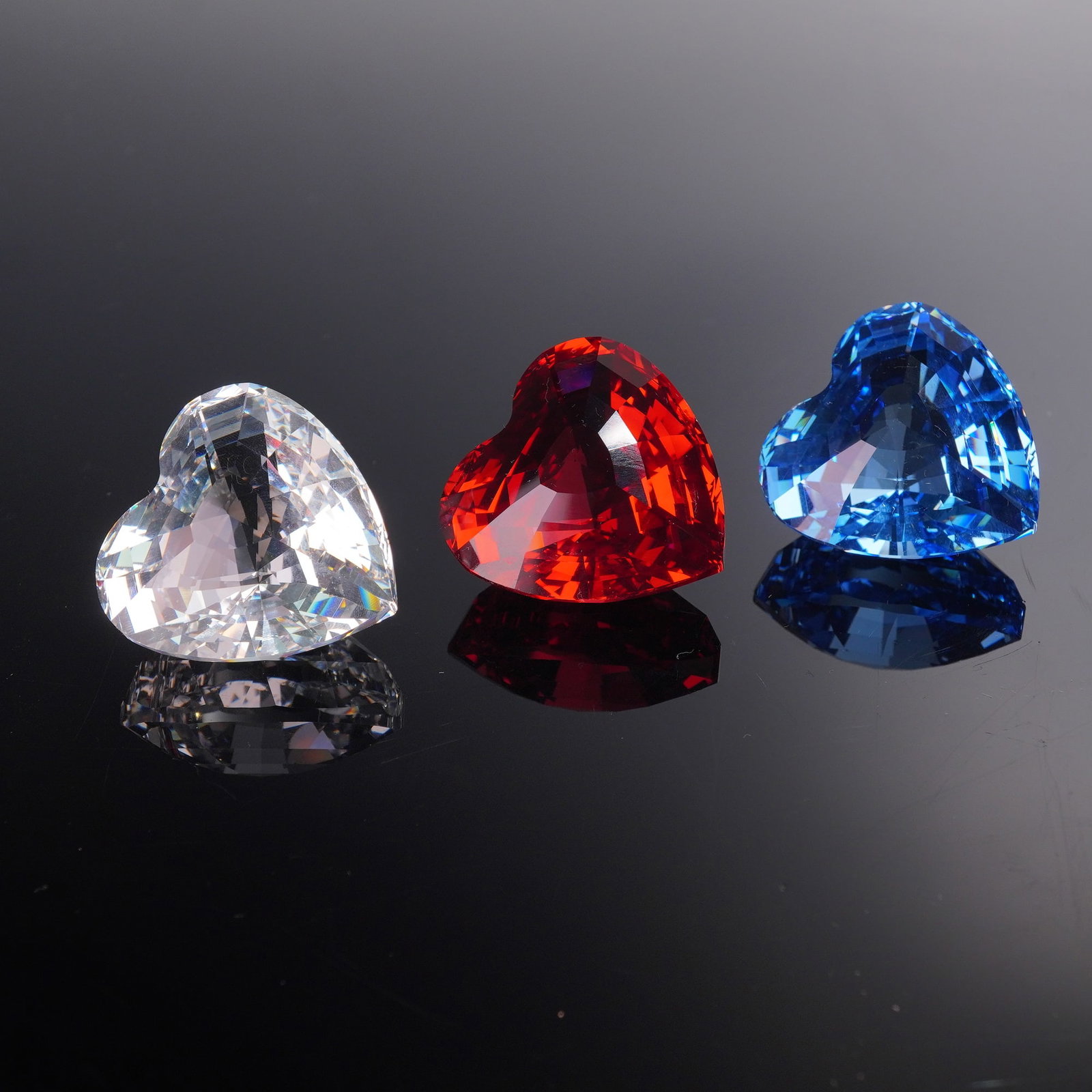 3pc Swarovski Crystal Heart Figurines, 1996-1998 SCS Renewal Gifts: Offered here is a striking set of three Swarovski Crystal SCS renewal gift hearts from 1996 through 1998. Each heart is expertly faceted and presented in brilliant colorways: one in clear crystal, one