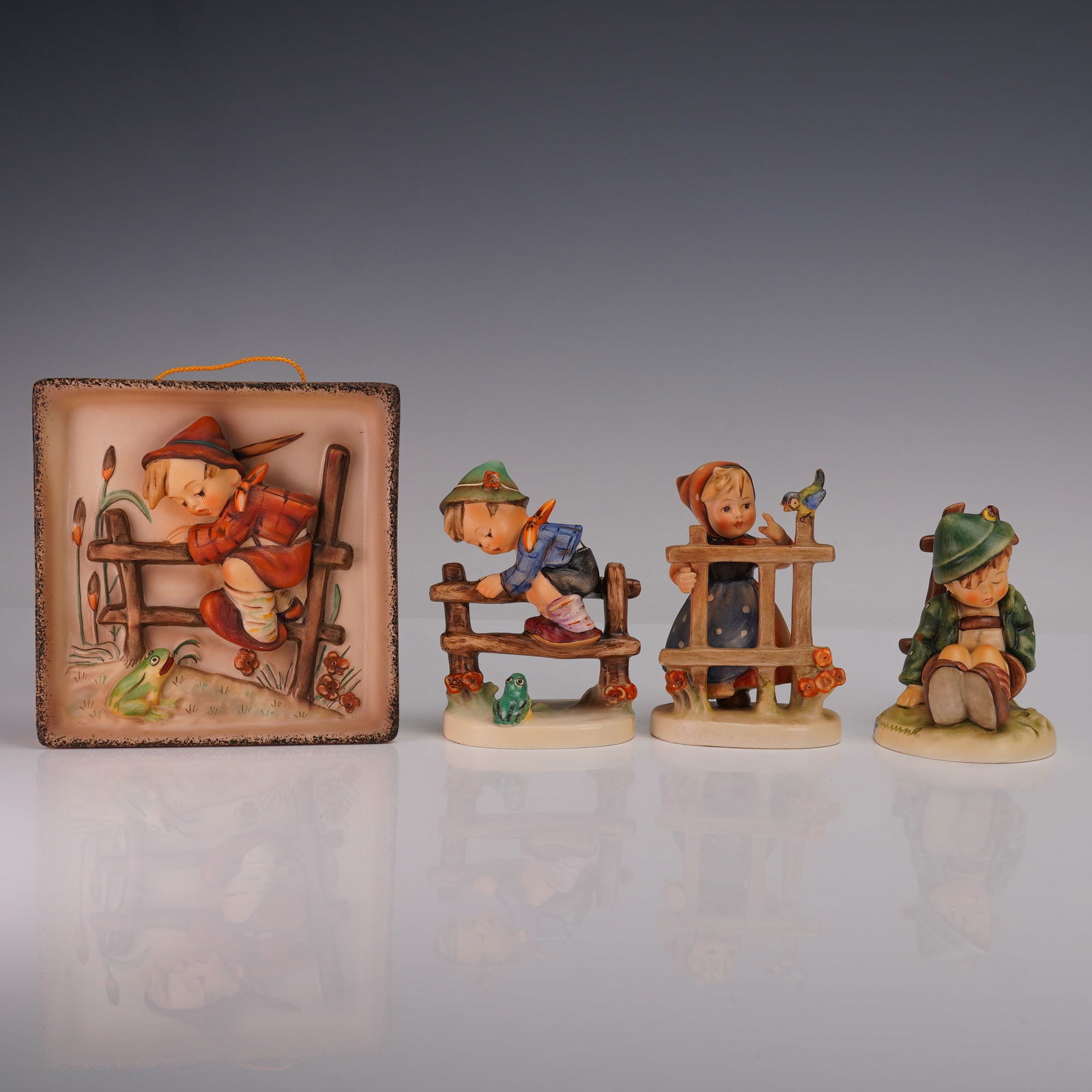 4pc Goebel Hummel Figurines and Wall Plaque: This endearing collection includes three figurines and one wall plaque, each hand painted with expressive detail. Afternoon Nap shows a young boy resting peacefully, his cap pulled low as he dozes on