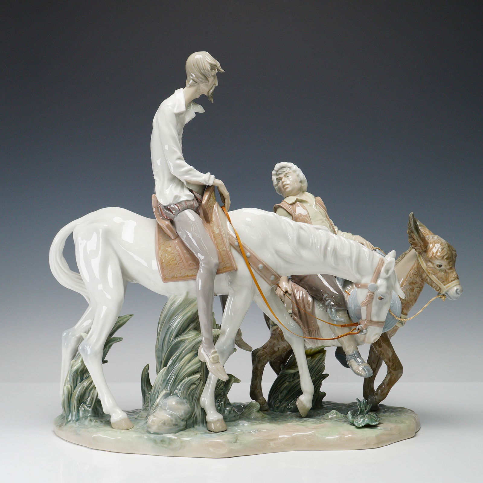 Lladro Porcelain Sculpture, Impossible Dream 1001318: A striking Lladro porcelain figurine titled Impossible Dream, model 1001318, depicting Don Quixote on his horse alongside Sancho Panza on his donkey. This limited edition piece is number 246 from an e