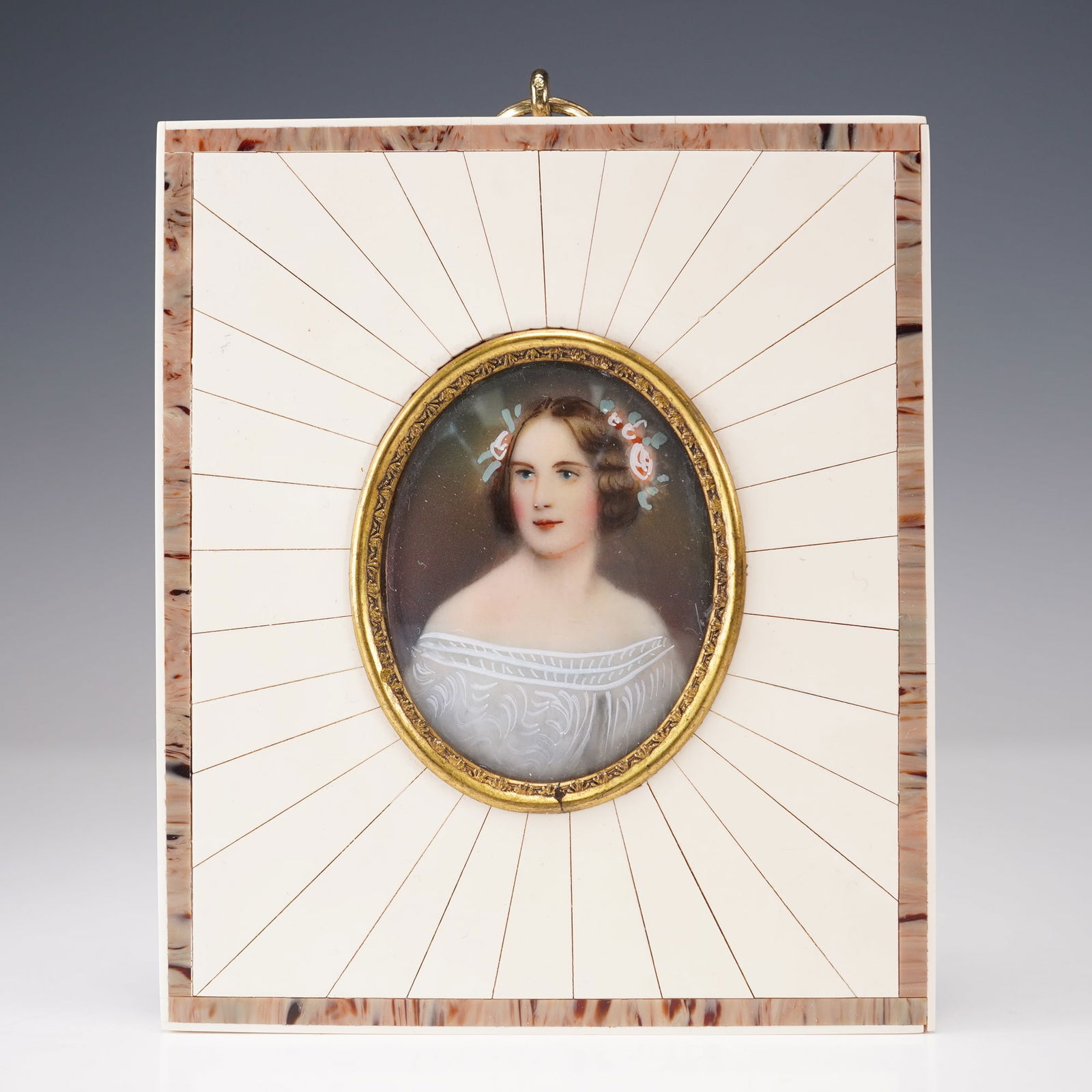 Vintage Hand Painted Portrait Miniature Jenny Lind in Decorative Bone Frame: Hand painted portrait miniature depicting Jenny Lind in an off-the-shoulder white gown with delicate lace patterning, her hair styled in soft curls adorned with pink and white flowers. The portrait is
