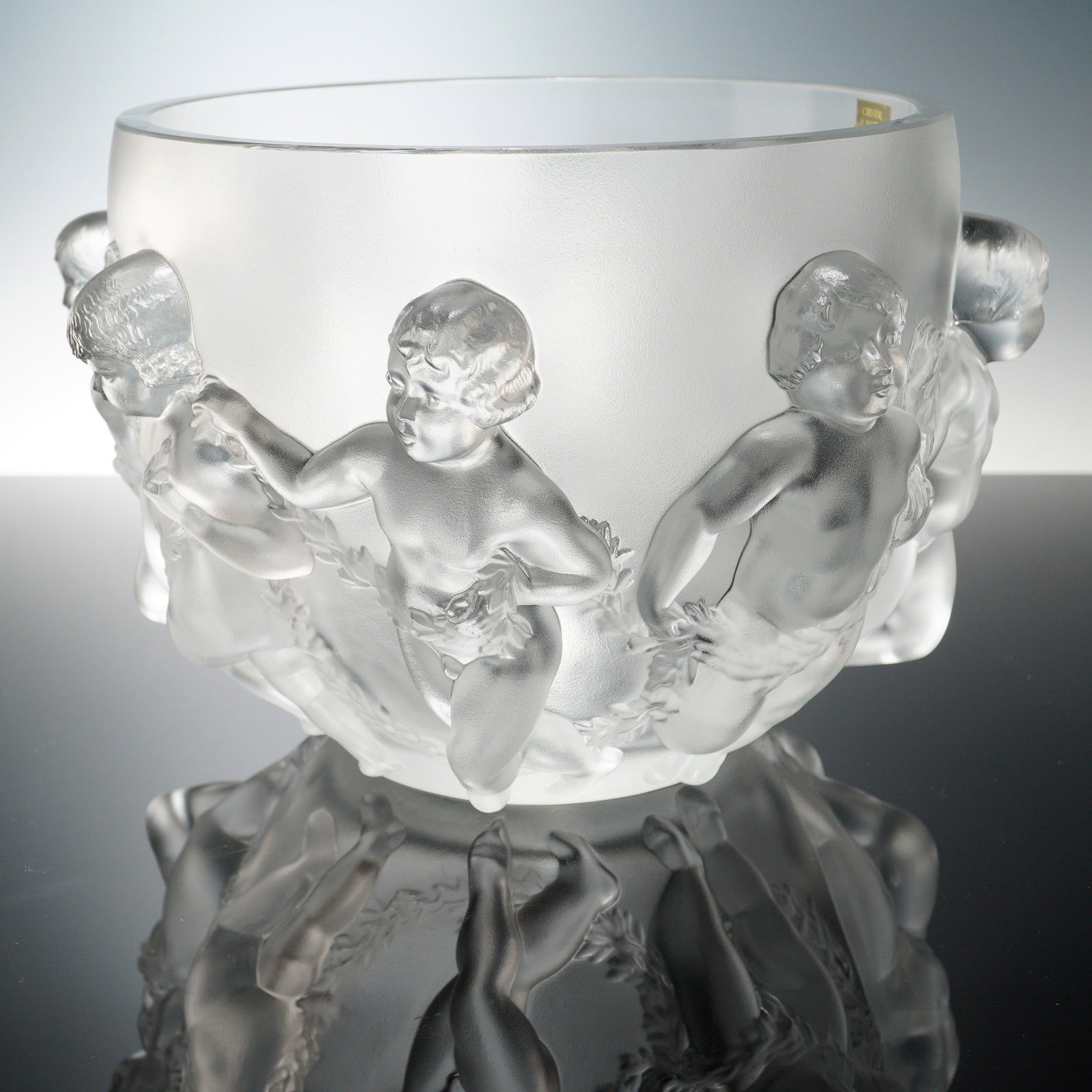 Lalique Crystal Centerpiece Bowl, Luxembourg: This exquisite Lalique crystal centerpiece bowl, titled Luxembourg, exemplifies the masterful artistry and refined elegance of Rene Lalique's enduring legacy. Crafted in France, the large round form f