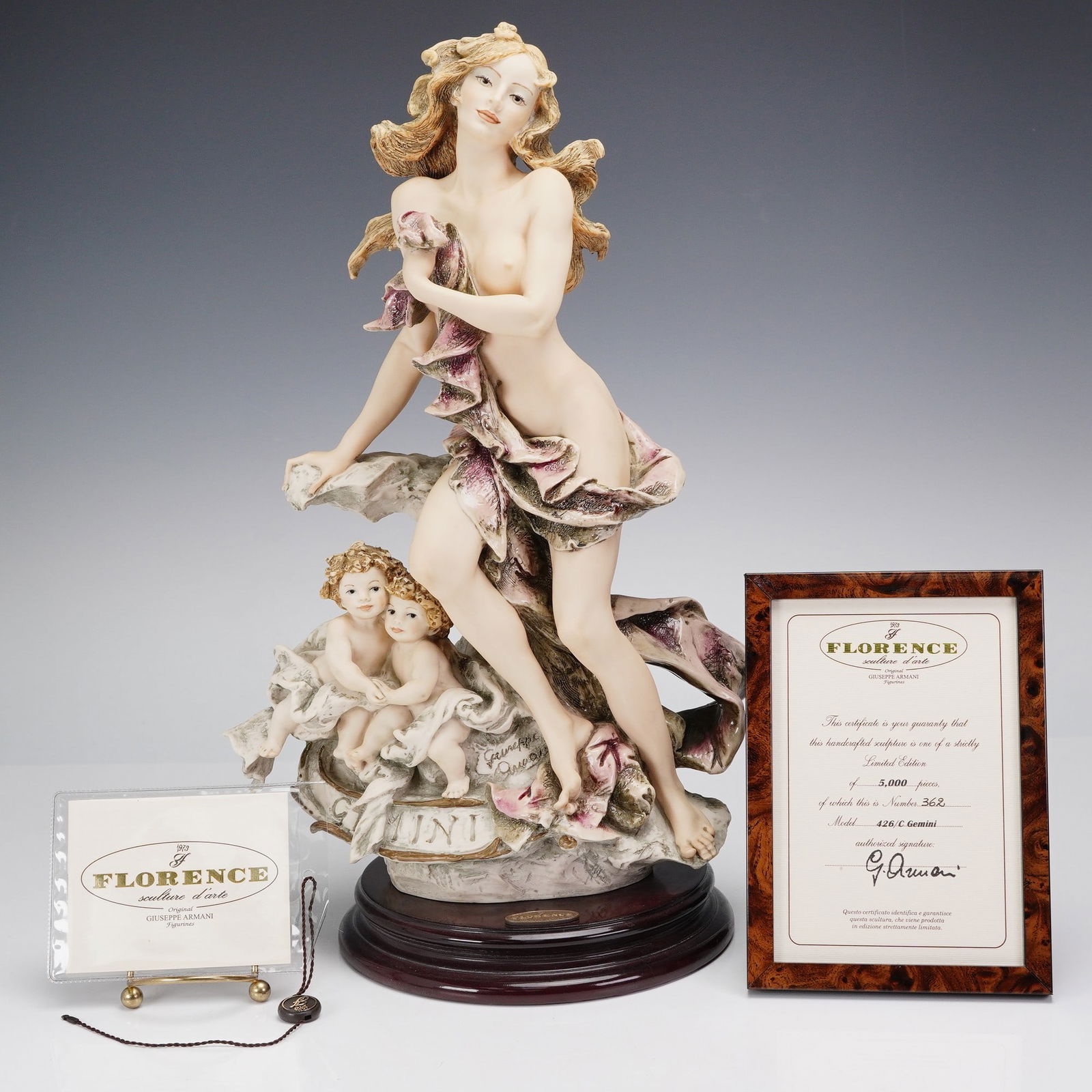 Florence Giuseppe Armani Zodiac Sculpture, Gemini 426C: A limited edition, Art Nouveau style beauty with a putti twins who symbolize Gemini. Sculpture is attached to round base. Giuseppe Armani impressed, Capodimonte backstamp and Florence Giuseppe Armani