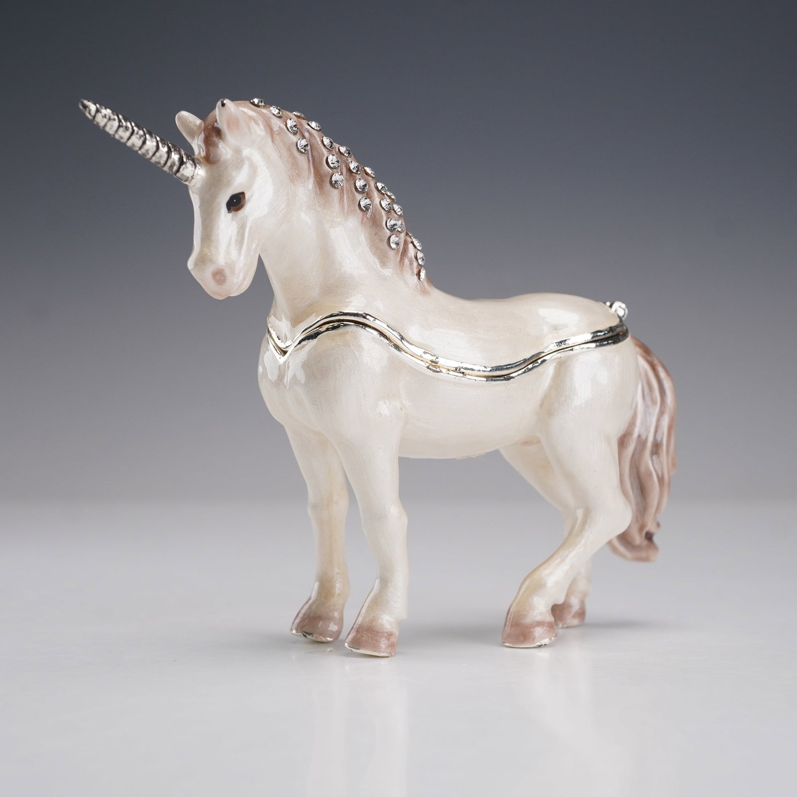 Unicorn Ring Box Enamel with Crystals Hand Painted: This elegant unicorn ring box features intricate hand-painted details and is crafted from enamel over metal, embellished with sparkling crystals. The unicorn stands gracefully, with its spiraled horn 