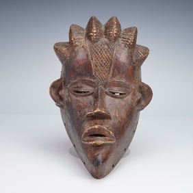 African Carved Wooden Mask with Geometric Detail