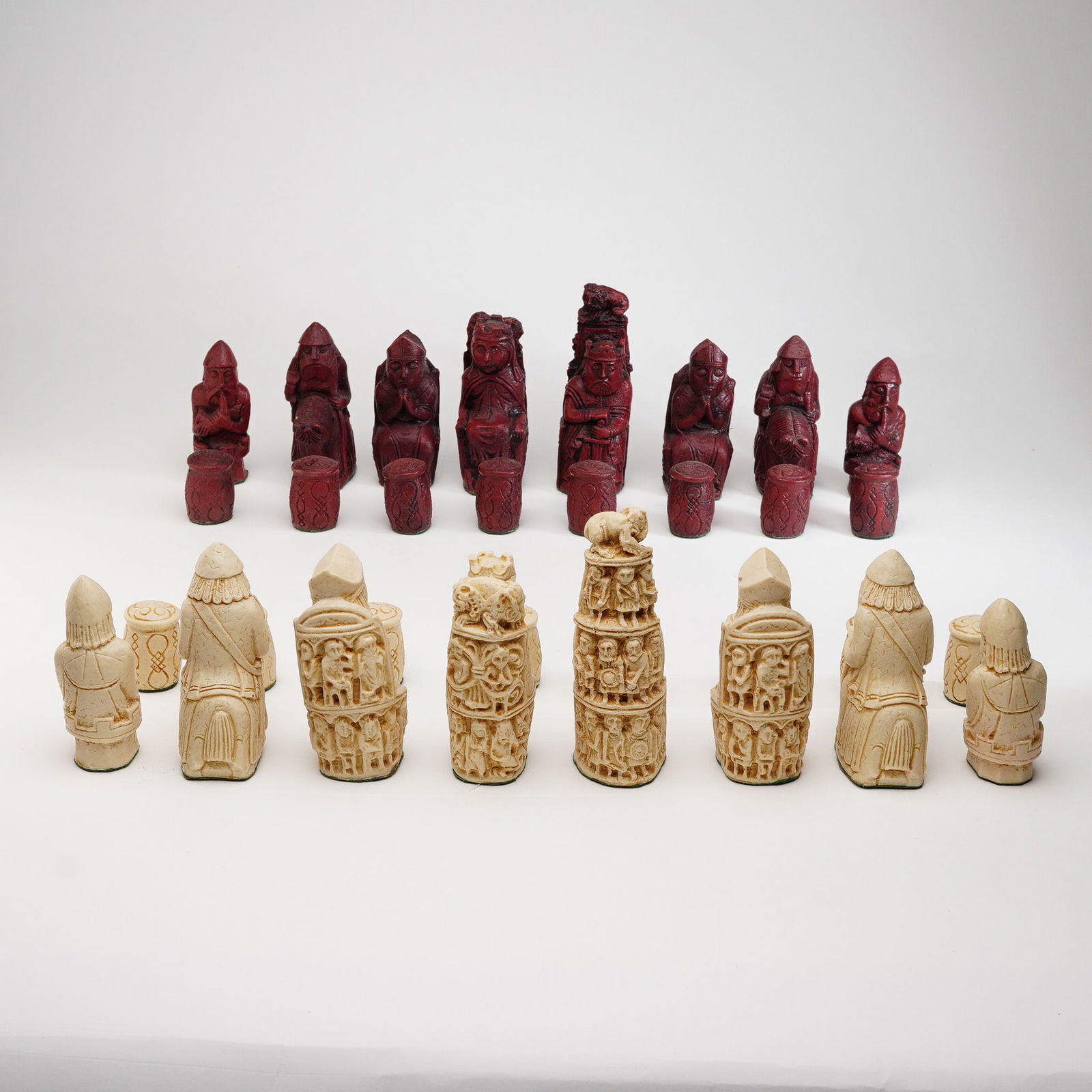 32pc Leipzig German Reproduction Medieval Chess Set: This chess set is a reproduction of a traditional bone German chess set carved in the fourteenth century, currently housed in a museum in Leipzig, Germany. The design, widely popular in England during