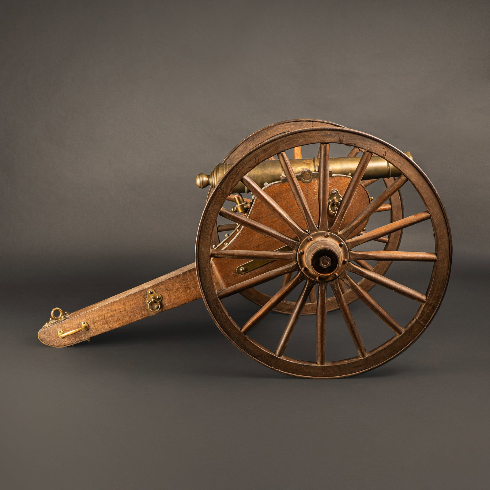 Mexican-American War Bronze Field Cannon on Wooden Carriage, 19th Century: Bronze field cannon mounted on a traditional wooden carriage, characteristic of artillery used during the mid-19th century, including the Mexican-American War (1846-1848). The cannon features a smooth