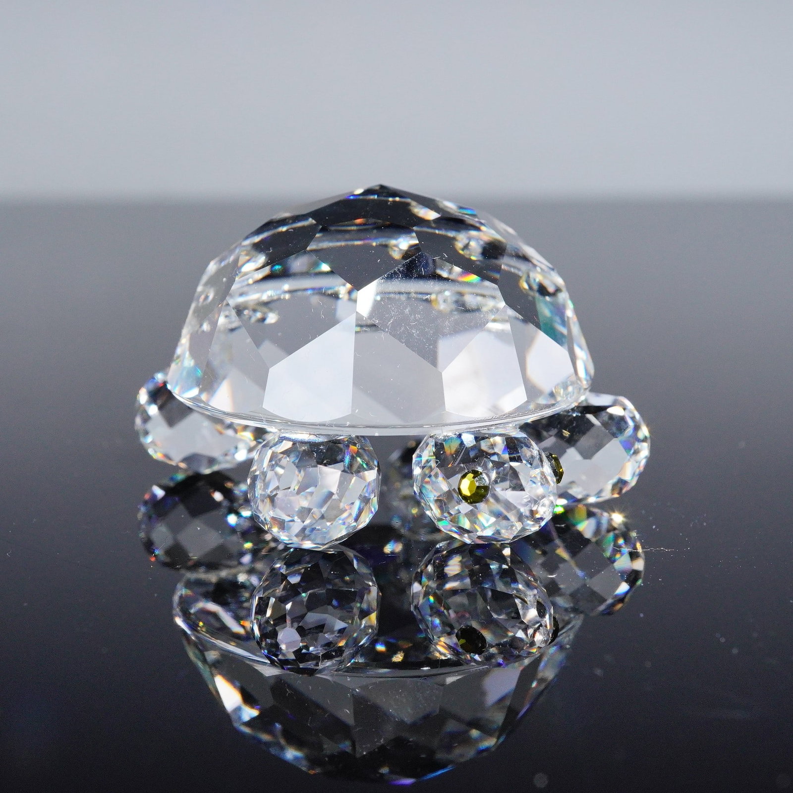 Swarovski Crystal Figurine, Large Tortoise: A Swarovski Silver Crystal figurine depicting a large tortoise, finely crafted in faceted clear crystal with detailed shell and rounded limbs. The piece carries the Swarovski swan backstamp, confirmin