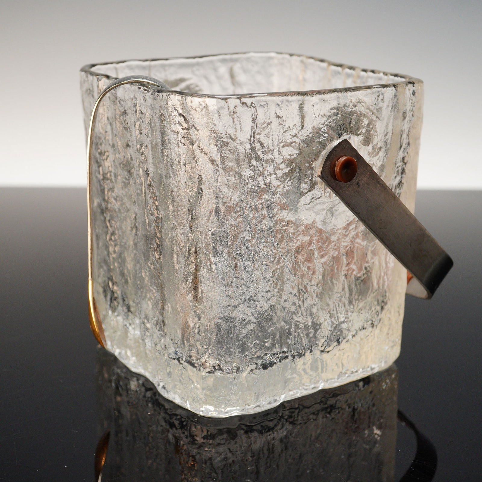 Hoya Glass Ice Bucket With Tongs: Vintage Hoya glass ice bucket featuring a bold textured surface in a squared design. The bucket is fitted with a stainless steel handle, marked Hoya, accented with a leather grip. The lot also include