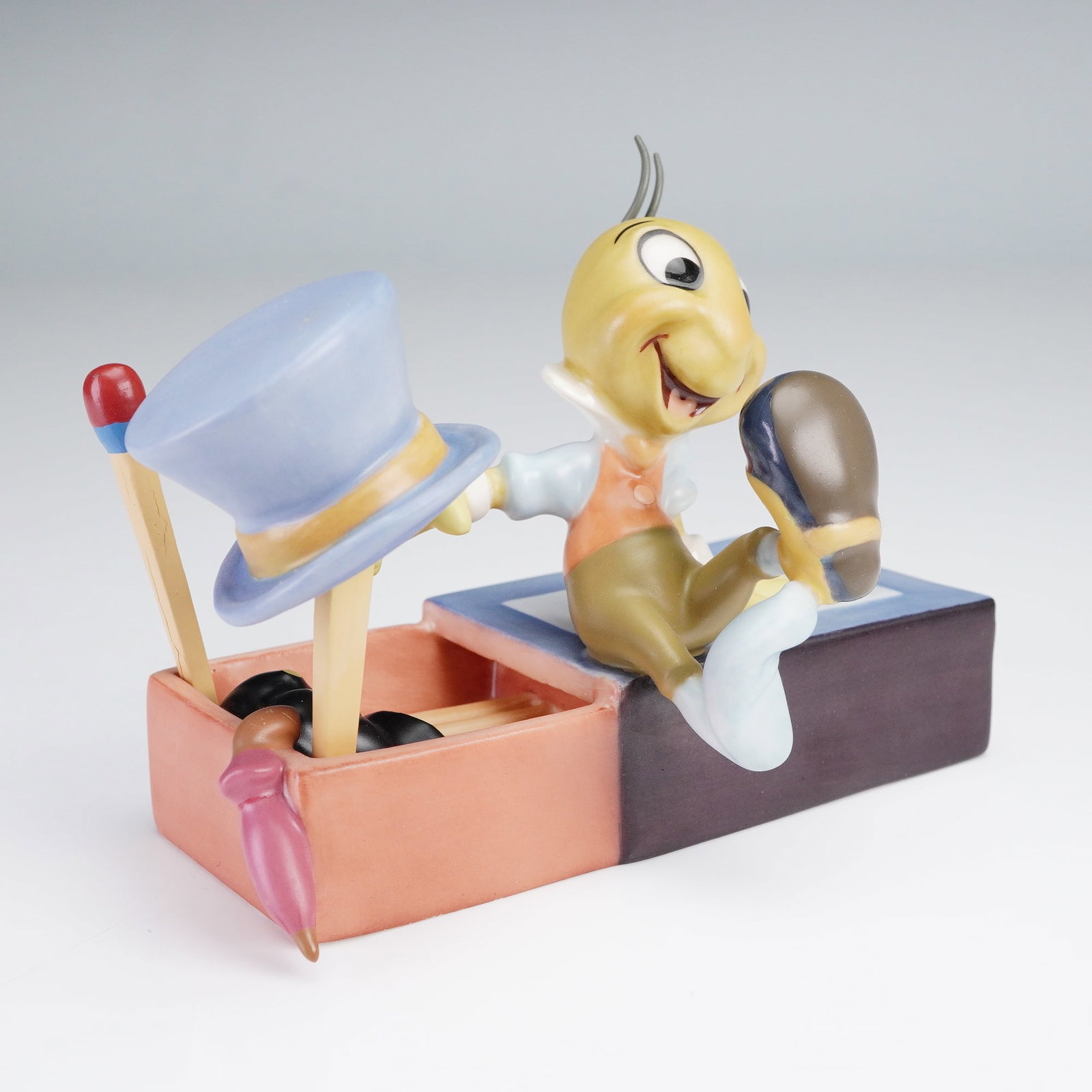 Walt Disney Classics Figurine, Jiminy Crickey, Let Your Conscience Be Your: This delightful Walt Disney Classics Collection figurine titled "Let Your Conscience Be Your Guide" features the ever-charming Jiminy Cricket from Disney's beloved classic Pinocchio. Crafted in fine p