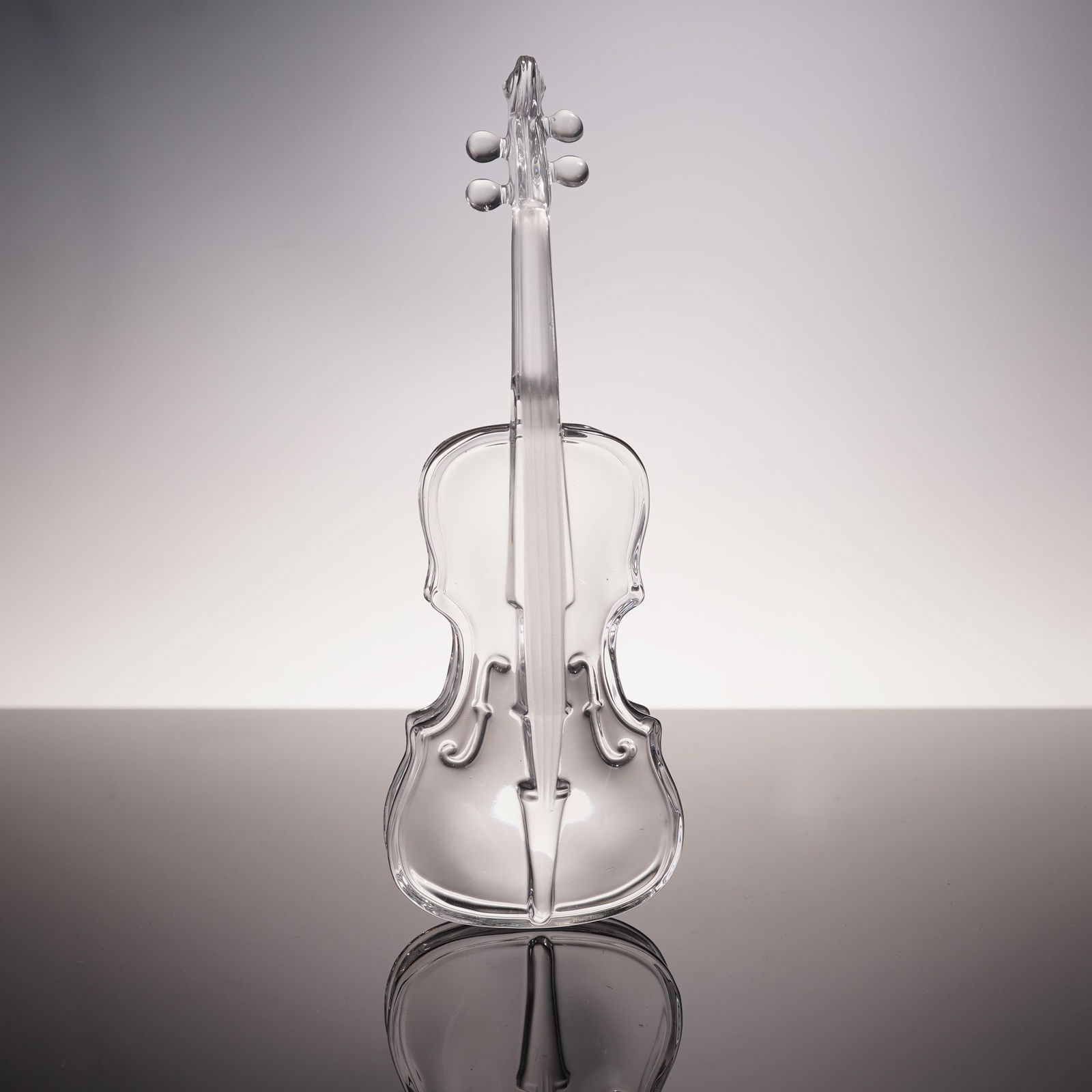 Hofbauer Crystal Violin Figurine: This exquisite Hofbauer crystal violin figurine is a fine example of crystal artistry, showcasing intricate detailing and clear, elegant lines. The delicate, hand-crafted design captures the graceful