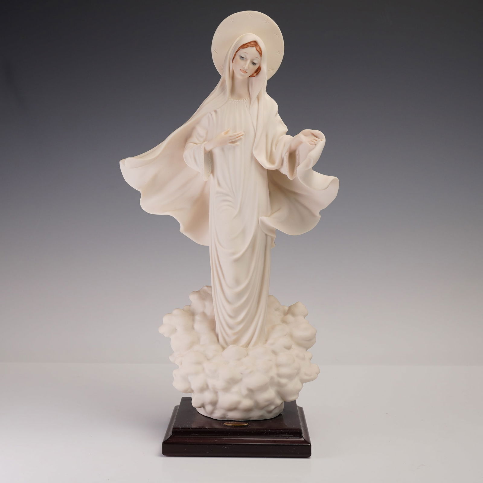 Giuseppe Armani Figurine, Madonna of Medjugorje: Giuseppe Armani porcelain figurine Madonna of Medjugorje, model 0803F, produced by Florence Sculpture d'Arte in Italy. Dated 1989, this sculptural work depicts the Madonna in serene flowing robes with