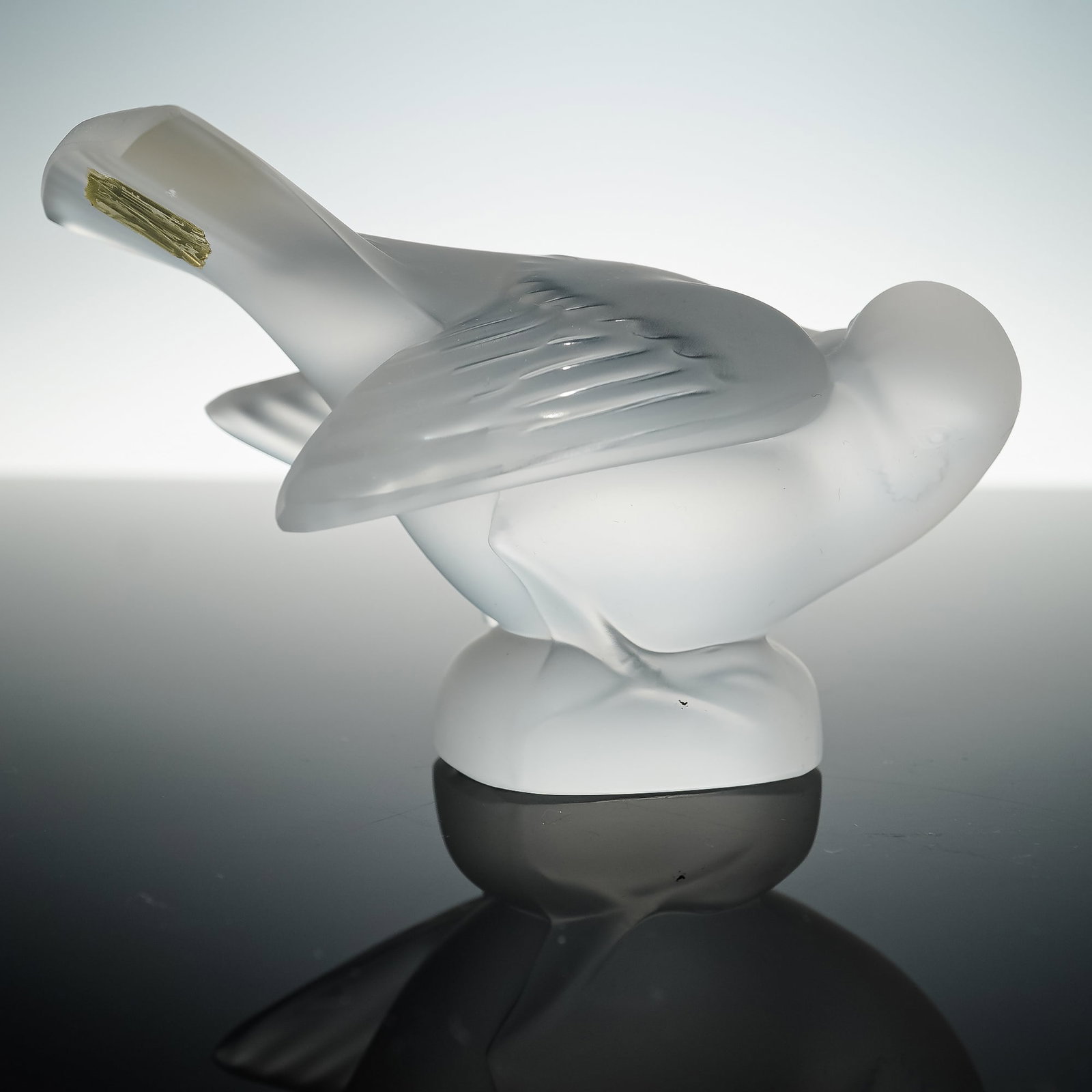 Lalique France Crystal Sparrow Figurine: A Lalique France crystal sparrow figurine with a frosted finish, detailed with outstretched wings. Retains Lalique Paris foil label and is etched Lalique France to the base. Issued: 20th century Dimen