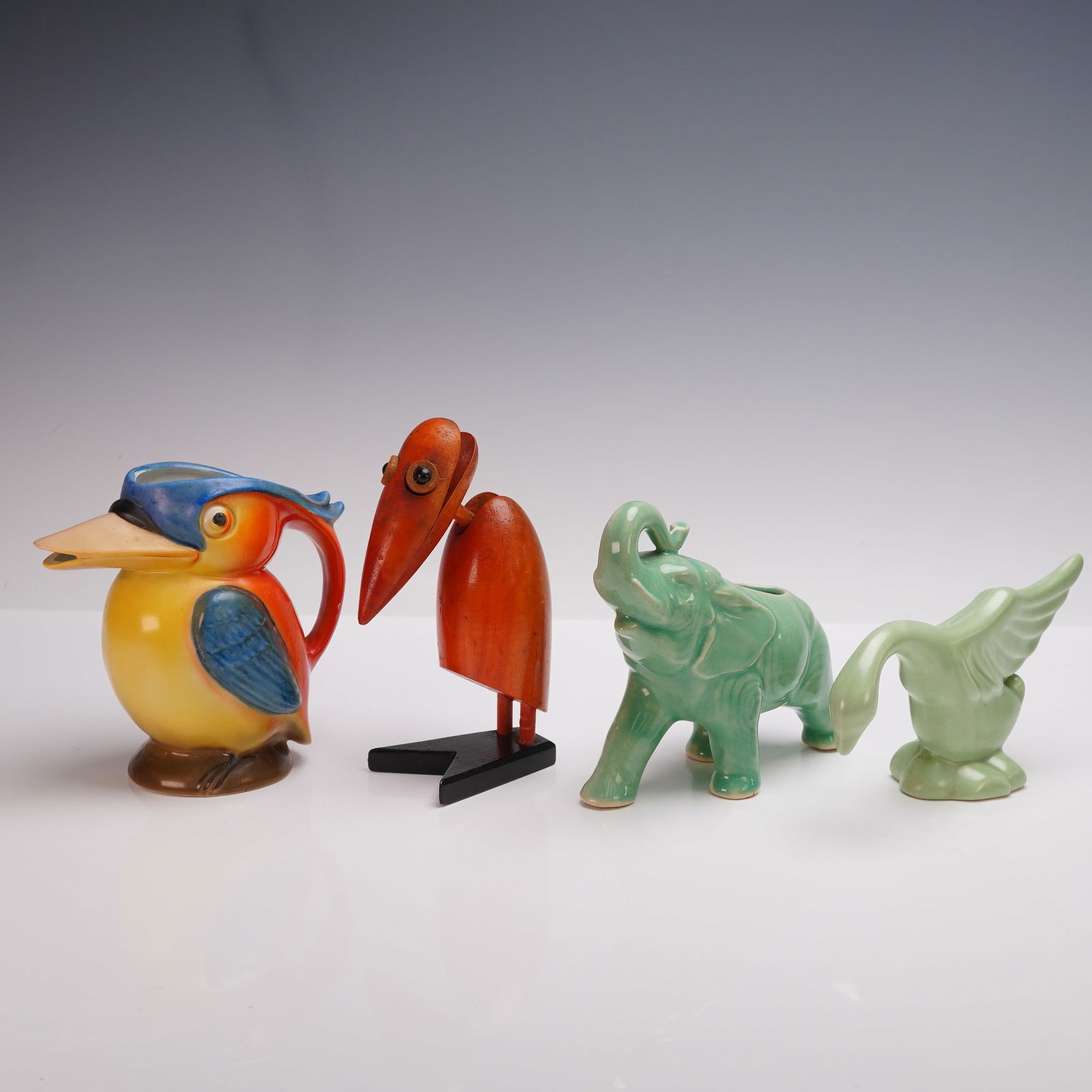 4pc Group of Figural Animal Planters and Figurines, Ceramic & Wood: A charming group of four figural animal decorative objects, including a hand-painted ceramic kingfisher pitcher marked Germany on the base, a mid-century carved wooden bird figurine with exaggerated b