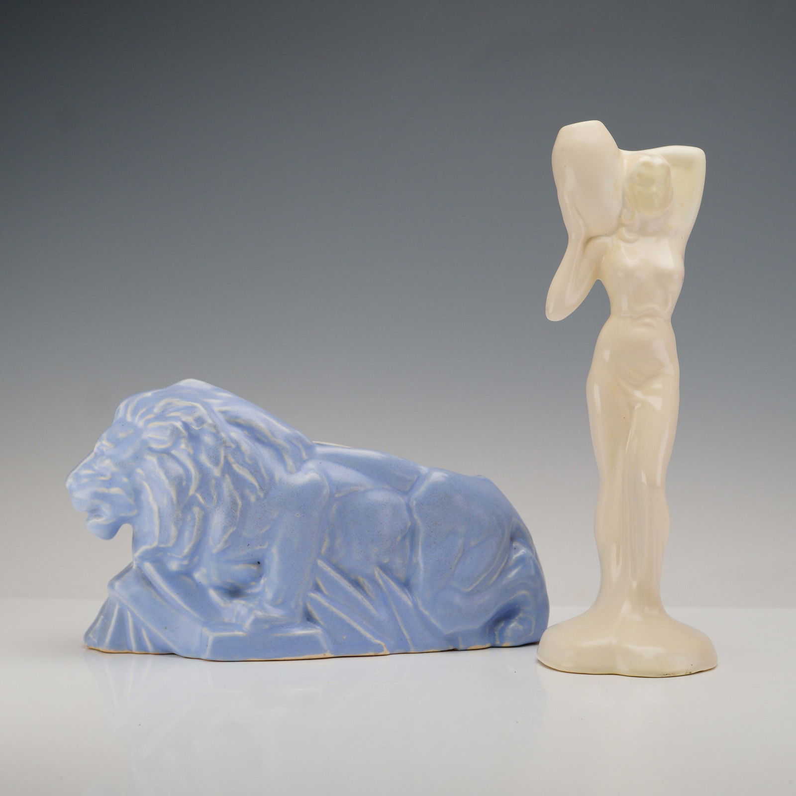 2pc Ceramic Vase and Planter, Female Figure and Lion: Pair of American art pottery pieces including a stylized nude female figure vase and a reclining lion planter. The female figure features a vessel with an opening at the top that is hollow through the