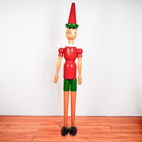 Oversized Wooden Pinocchio Figure with Classic Red and Green Attire