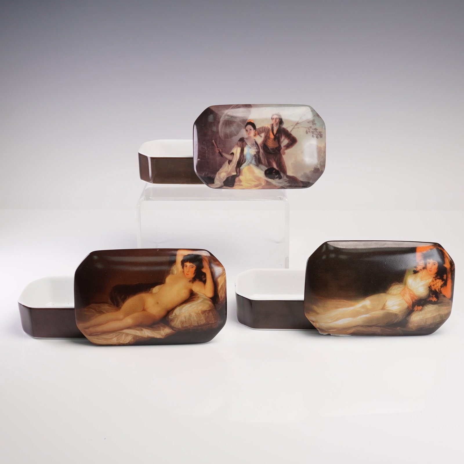 3pc Porcelain Painted Box Grouping, Erotic Art, Giordano di Ponzano: This exquisite 3-piece porcelain box set features hand-painted depictions of classic erotic art. Each piece is meticulously crafted with vibrant, detailed artwork that beautifully enhances the rich, d