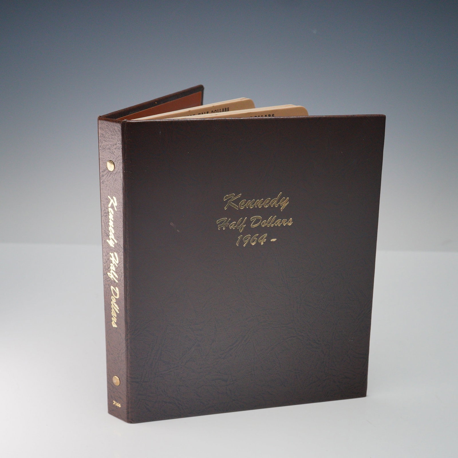 1964-2017 Kennedy Half Dollars in Booklet: Kennedy half dollars housed in a Kennedy Half Dollars 1964-Date folder. The obverse features the profile of John F. Kennedy, designed by Gilroy Roberts just hours after the president's assassination i