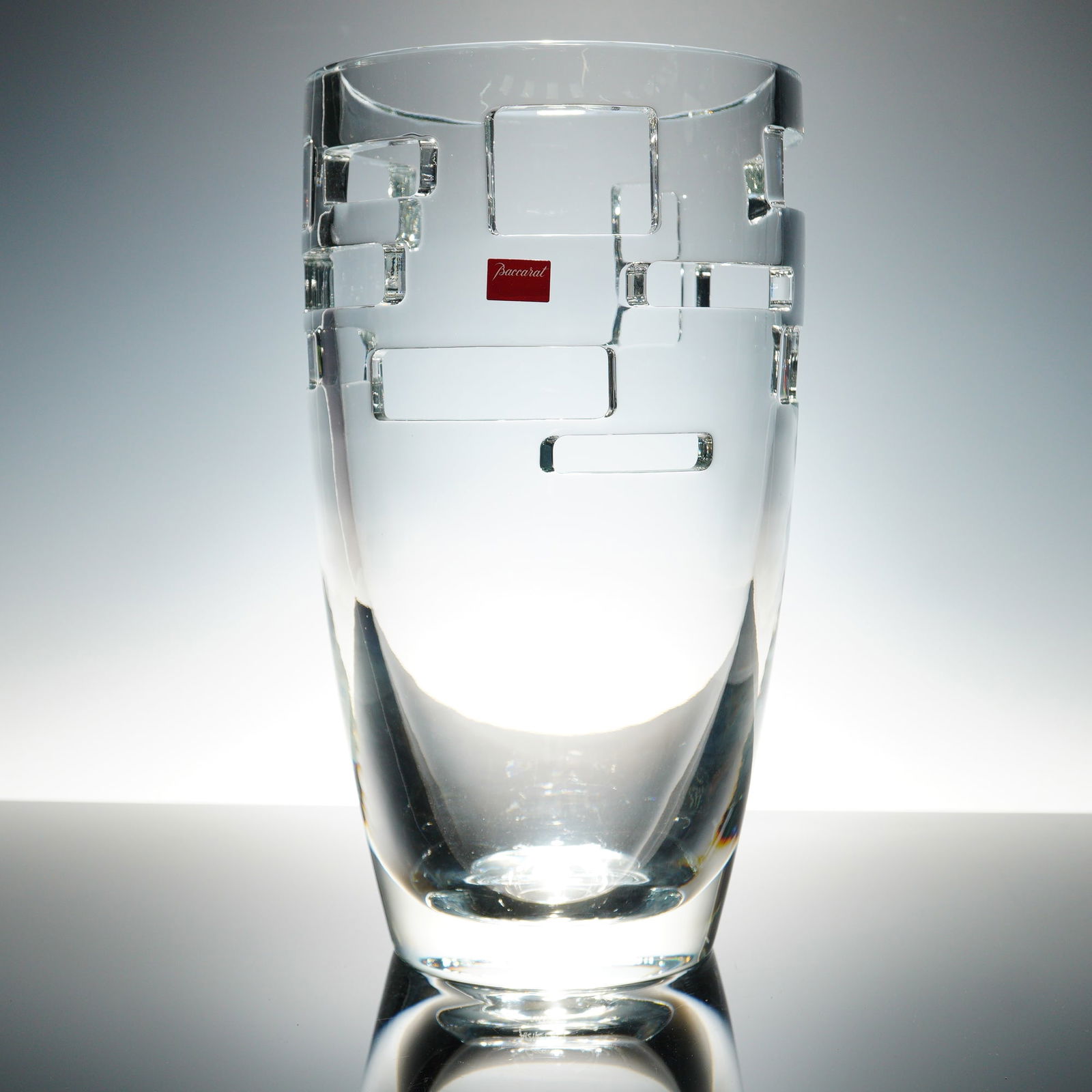 Baccarat by Arik Levy Crystal Vase, Intangible Window: The clear crystal vase showcases a geometric pattern of square and rectangular cuts and was created in 2007 as part of a limited edition of 100 pieces. This piece is number 46 of 100 and is etched on