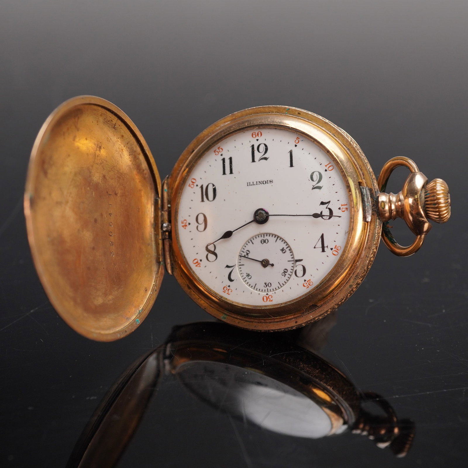 Illinois Gold Filled HC Pocket Watch, B&B Royal Case: Offered here is an Illinois pocket watch in a gold filled hunting case engraved with a monogram on the cover. The white enamel dial is signed Illinois and features black Arabic numerals, red outer min
