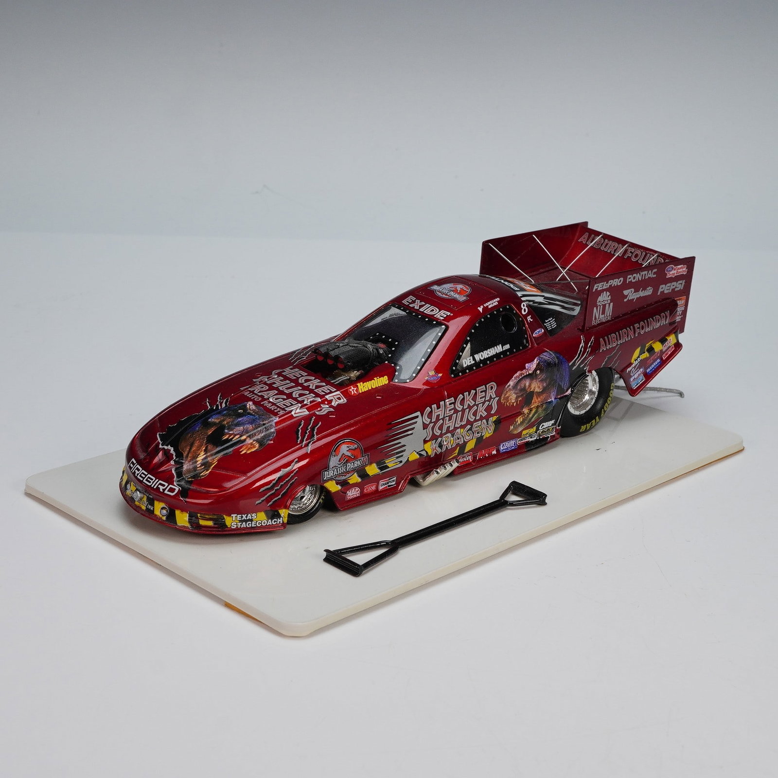Pontiac Firebird Drag Car Model, Castrol Syntec Del Worsham: This detailed 1:18 scale diecast model features the Castrol Syntec Pontiac Firebird drag car driven by Del Worsham. The car showcases vibrant red and yellow graphics, including branding from Checkers 