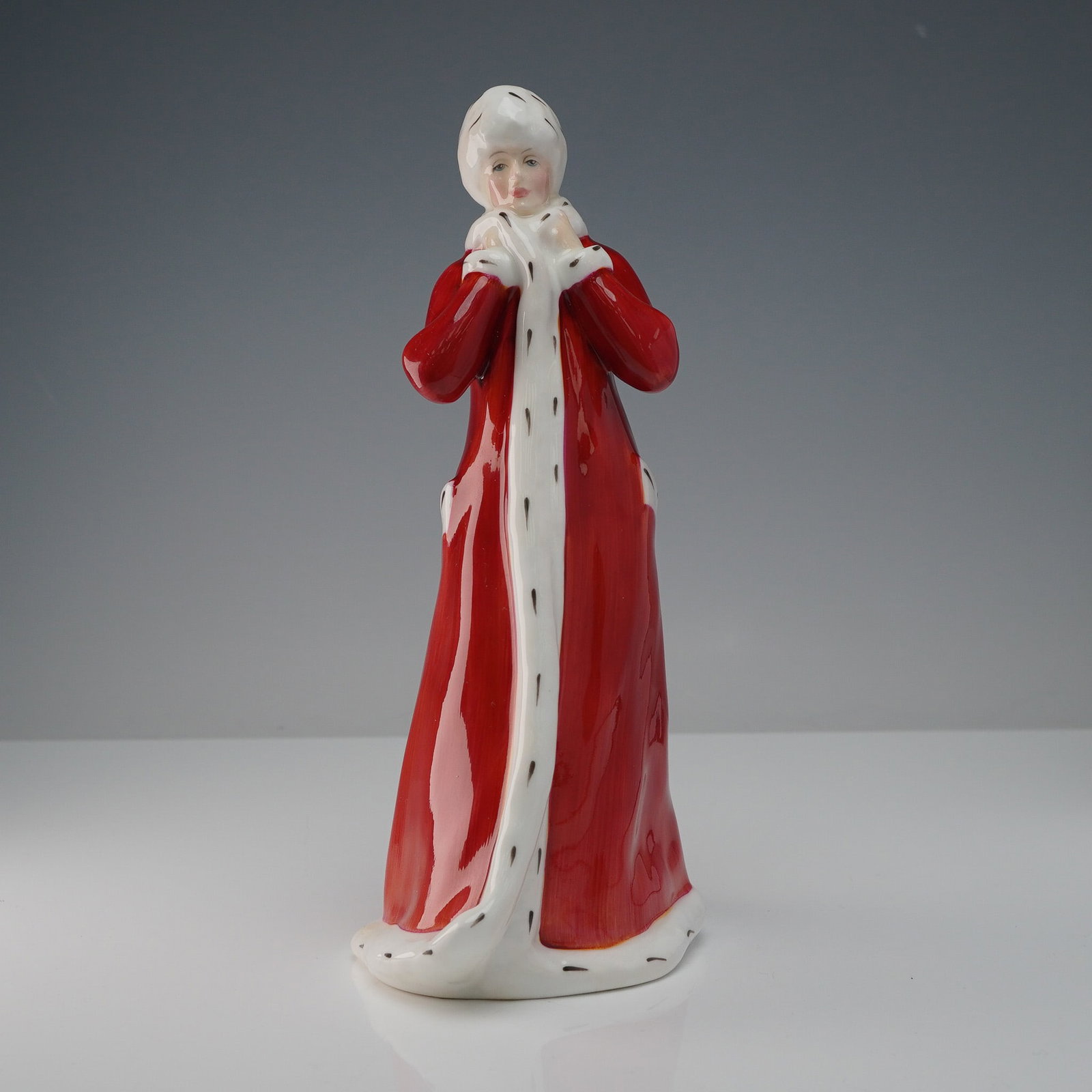 Royal Doulton Figurine, Wintertime HN 3060: A refined Royal Doulton porcelain figurine titled Wintertime, model HN 3060, designed by Amanda Hughes and issued exclusively in 1985 for the Royal Doulton International Collector's Club. This elegant