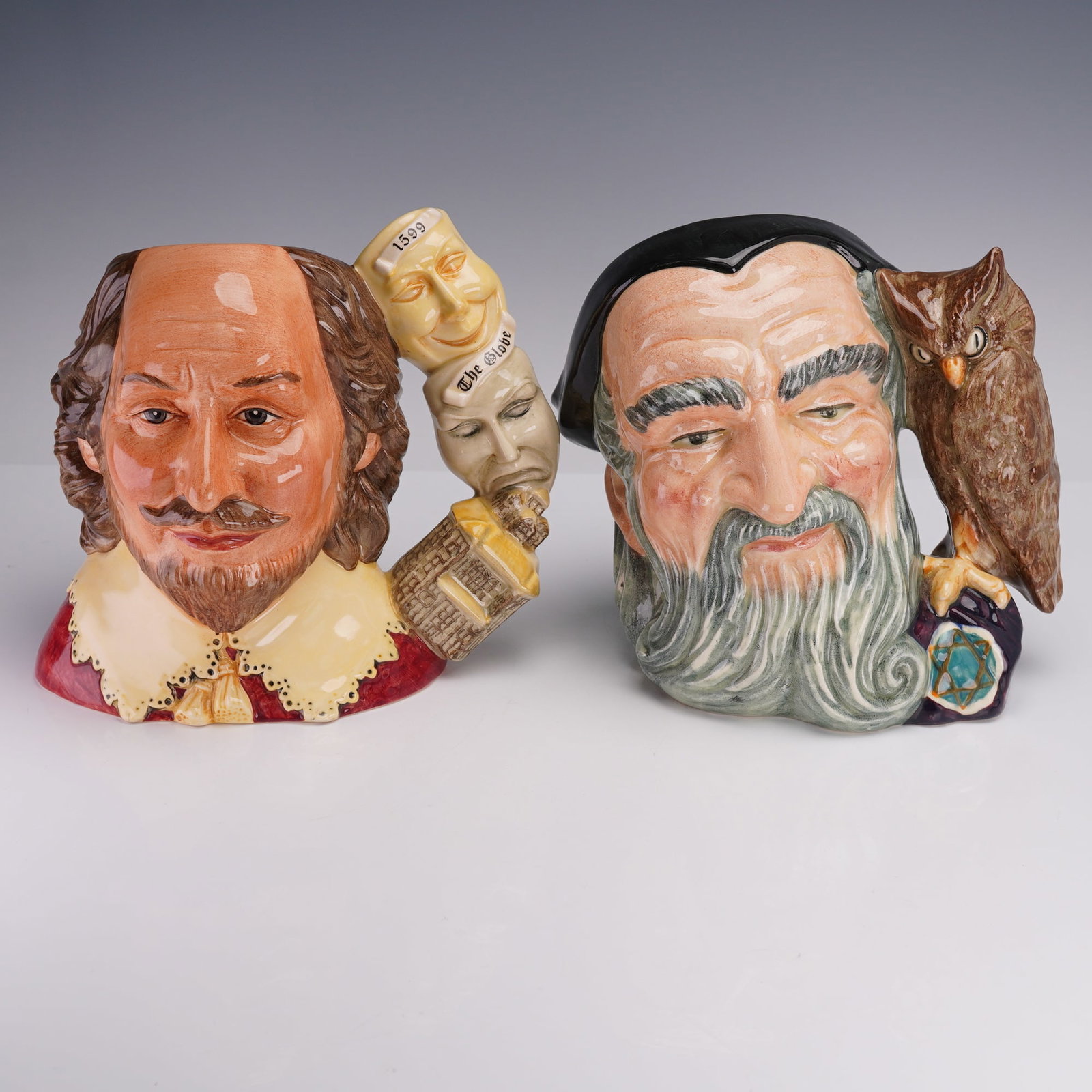 2pc Royal Doulton Large Character Jugs: Comprising two Royal Doulton large character jugs. The first is Merlin with Owl (D6529), depicting the legendary wizard with flowing hair and beard, accompanied by an owl forming the handle. The secon